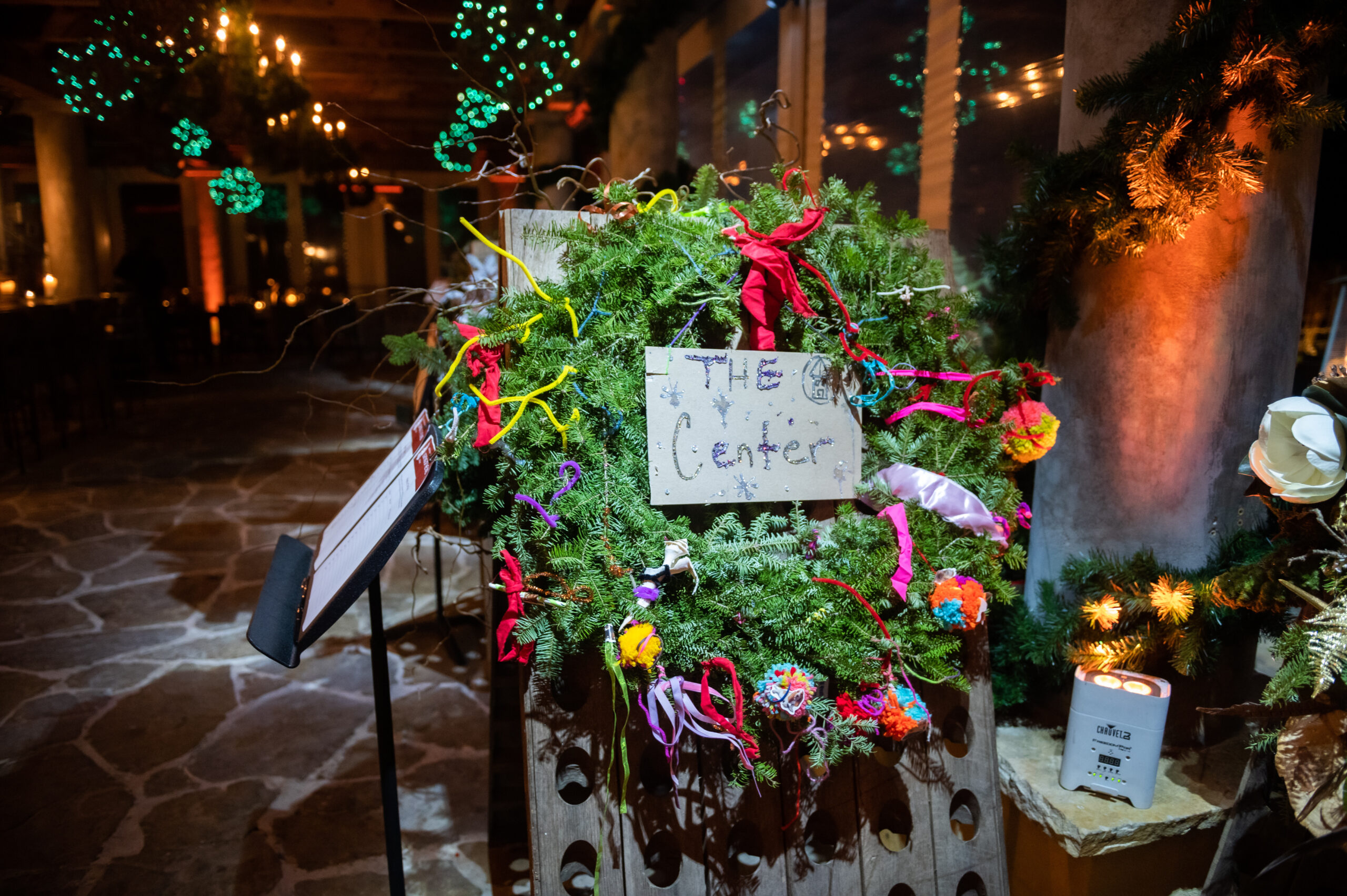 Wolffer Estate's annual charity wreath auction at the Lighting of the Vines is a fundraiser for the Bridgehampton Child Care and Recreational Center. The wreaths, made by several local artisans and florists, are sold during a silent auction and 100 percent of the proceeds go to the Center. MARK KOPKO