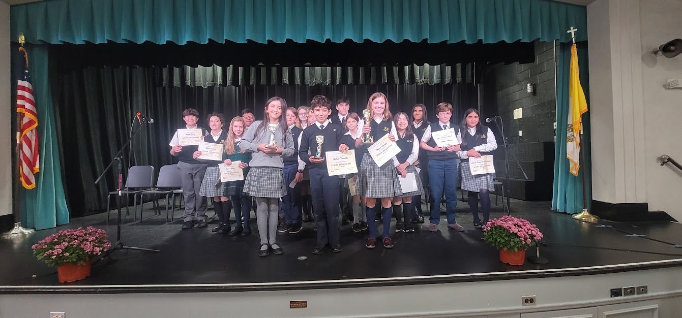 The contestants  in the recent spelling bee at Our Lady of the Hamptons, with the top three spellers in the foreground, left to right, Madison  Giraldo, Gabriel Torrealba, and Maeve Springer. COURTESY OUR LADY OF THE HAMPTONS SCHOOL