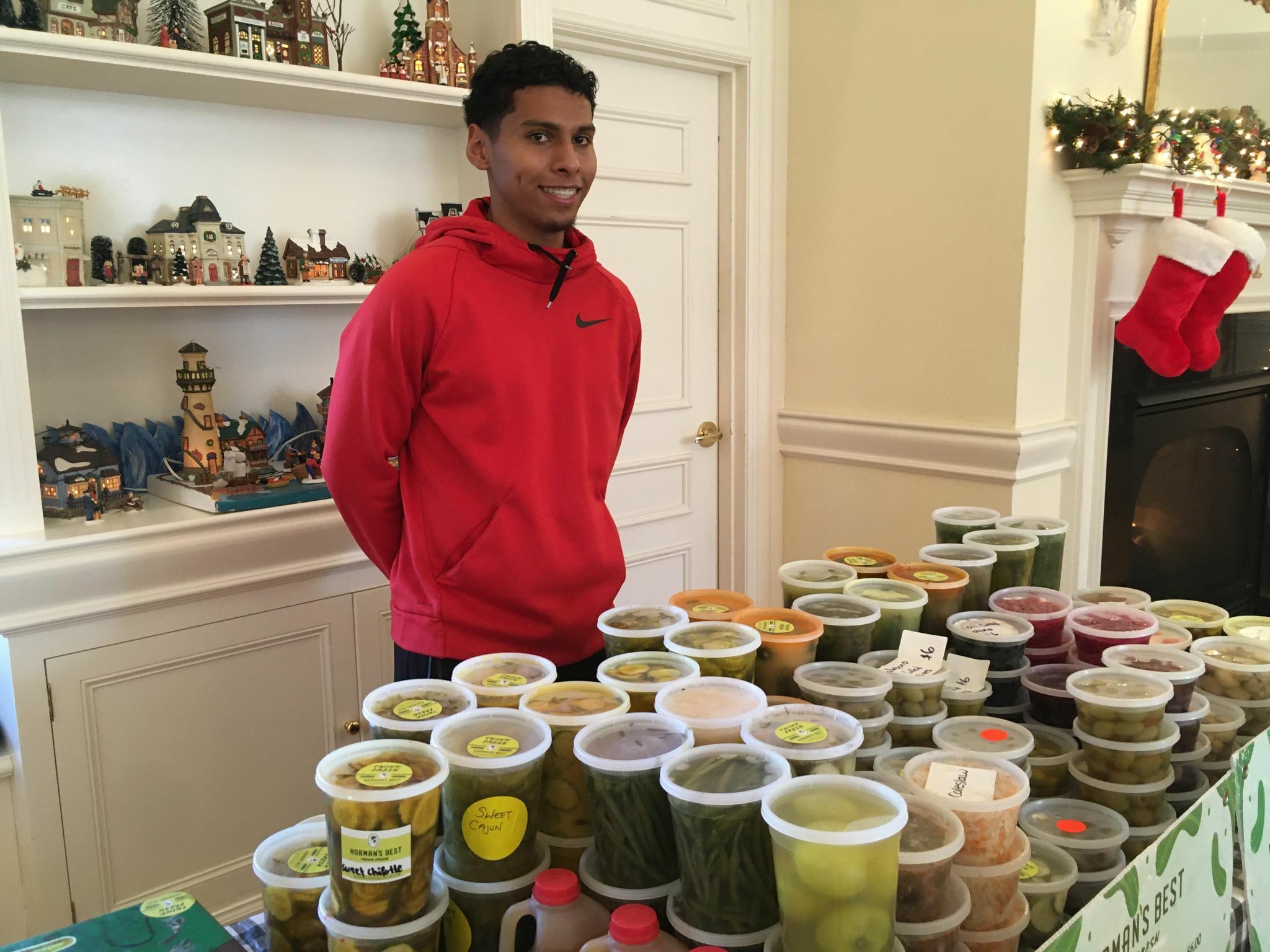 A panoply of pickled products  was overseen by Yunior Velasquez of Horaman's Best Pickle at the indoor market in Westhampton Beach.   KITTY MERRILL