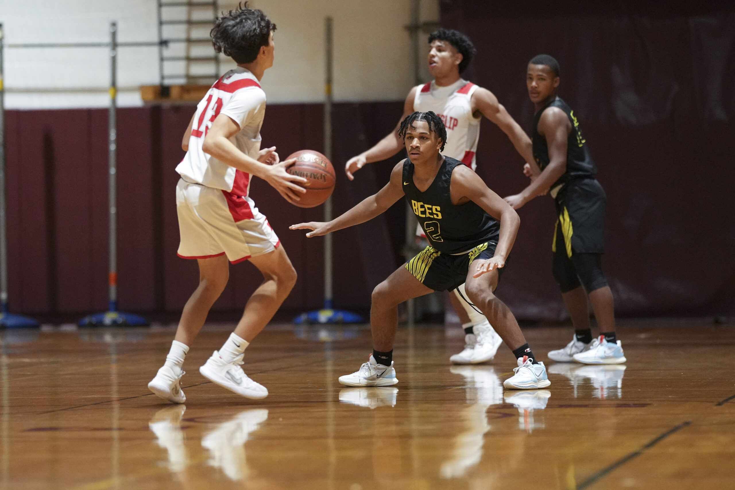 Bridgehampton freshman Jai Feaster covers East Islip sophomore Justin Adames.   RON ESPOSITO