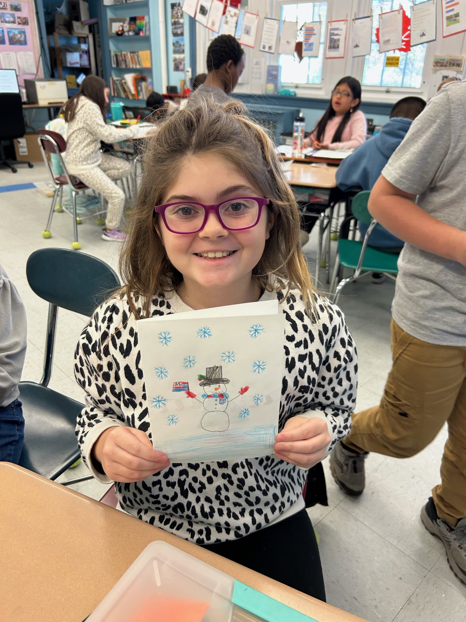 Hampton Bays Elementary School students, including Leila Blakaj, have been busy making holiday cards that will be sent to Hampton Bays School District alumni who are currently serving in the military. Cards will be sent to service members in Korea, Japan, Connecticut and Virginia Beach. COURTESY HAMPTON BAYS SCHOOL DISTRICT