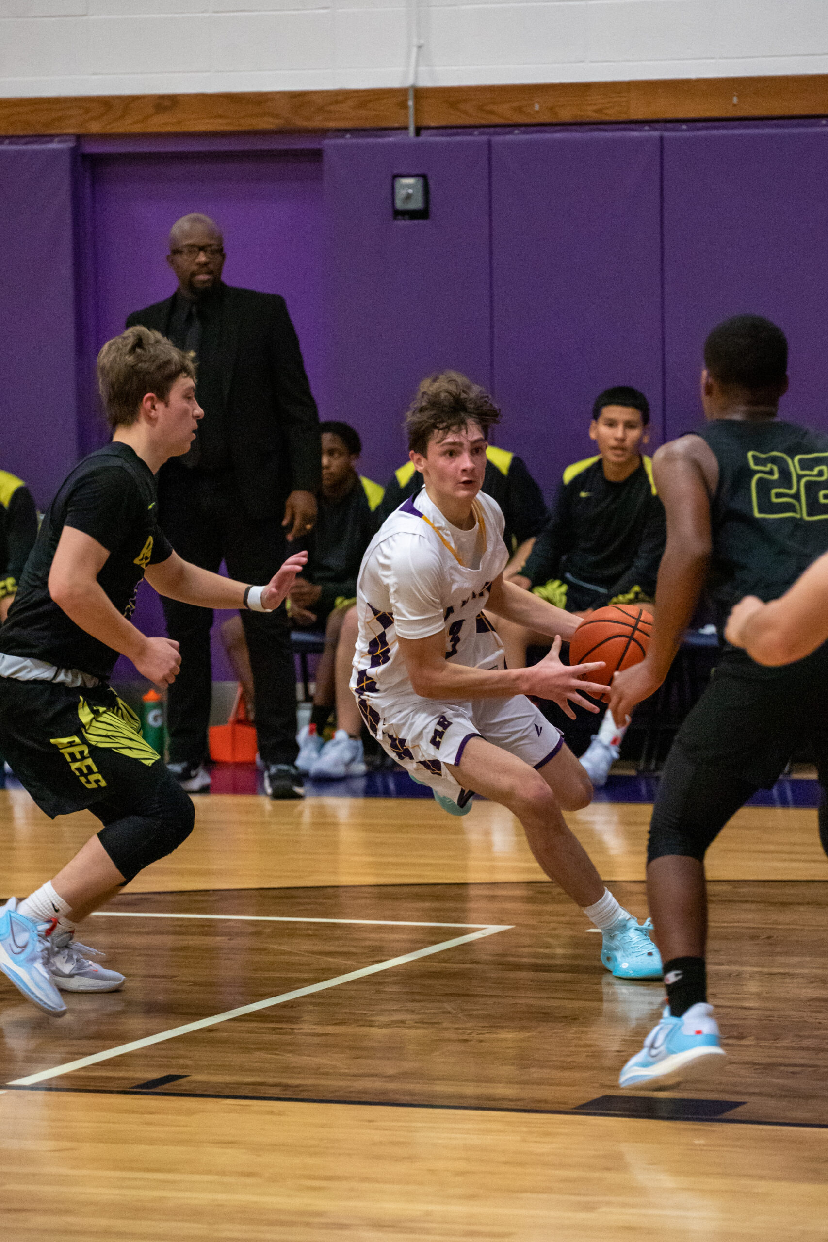 Hampton Bays junior James Powers weaves his way through traffic on the court.   MICHAEL O'CONNOR