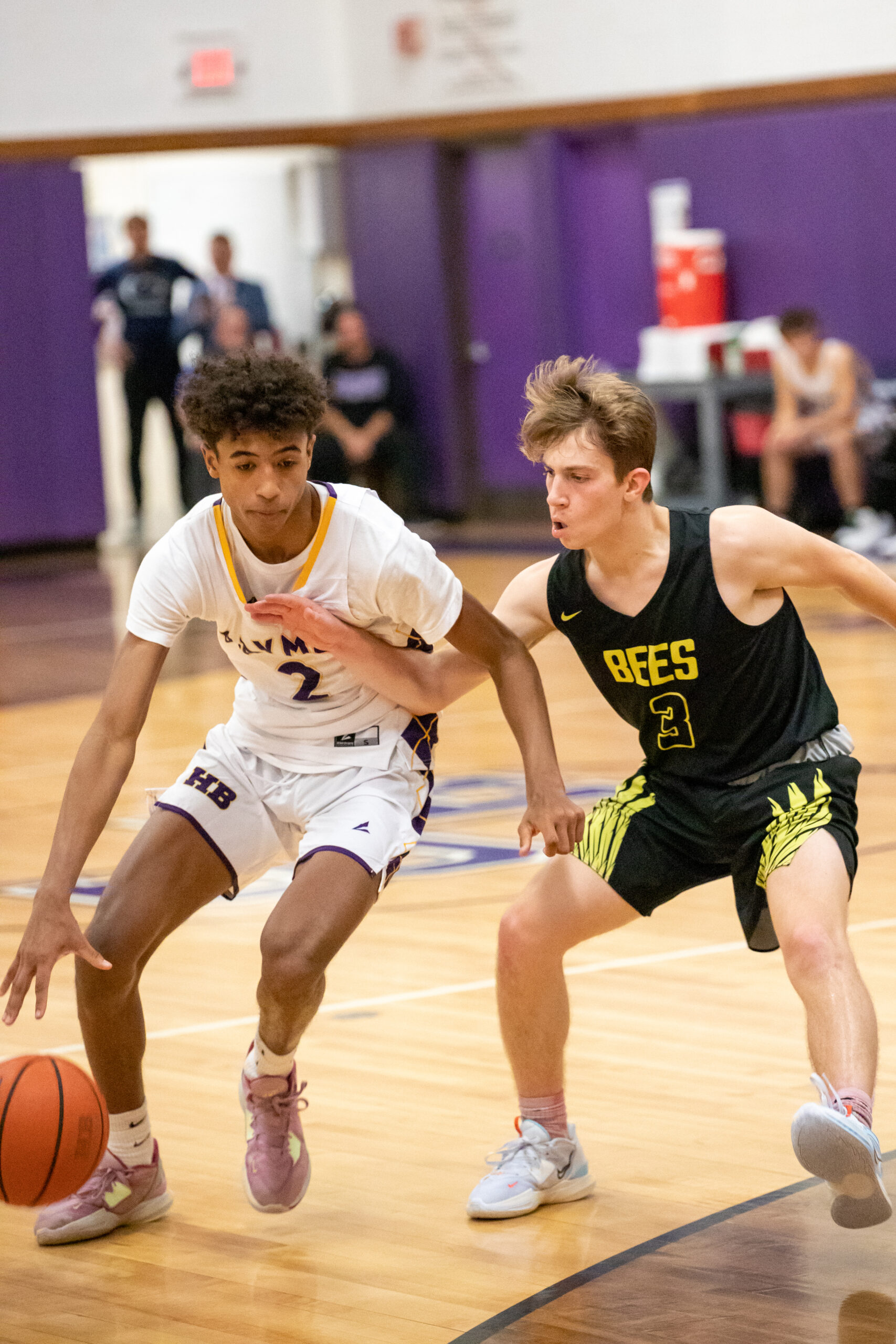 Hampton Bays senior Kazmin Johnson tries to drive on Bridgehampton senior Kris Vinski.    MICHAEL O'CONNOR