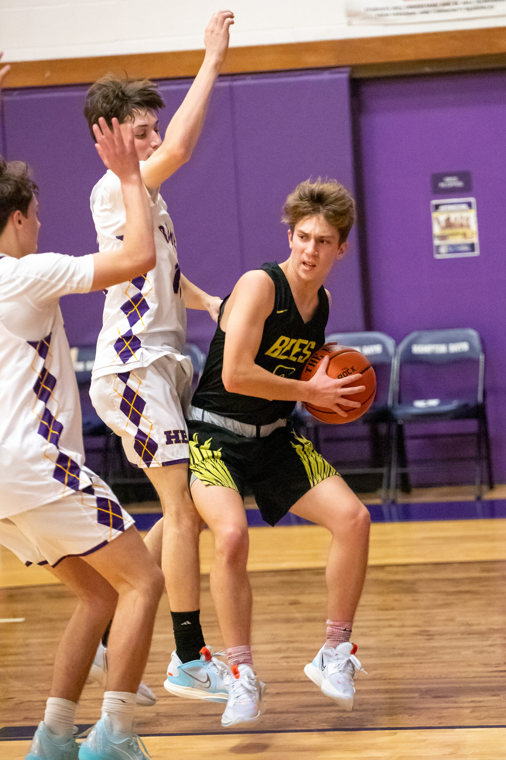 Bridgehampton senior Scott Vinski finds himself covered by a pair of Baymen underneath the hoop.    MICHAEL O'CONNOR