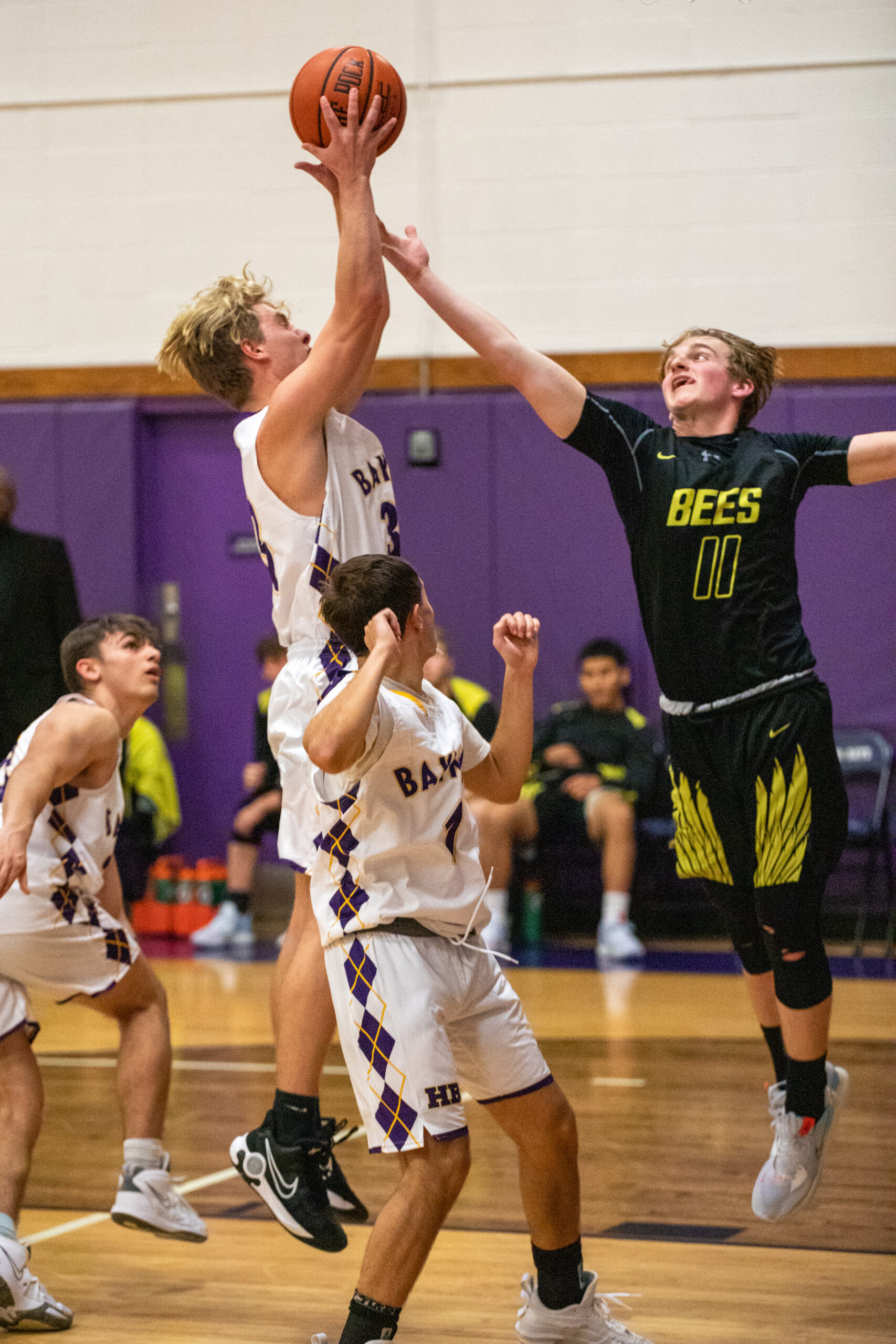 Hampton Bays senior Will Mendel grabs a rebound over an outstretched Bridgehampton senior Dylan Fitzgerald.    MICHAEL O'CONNOR