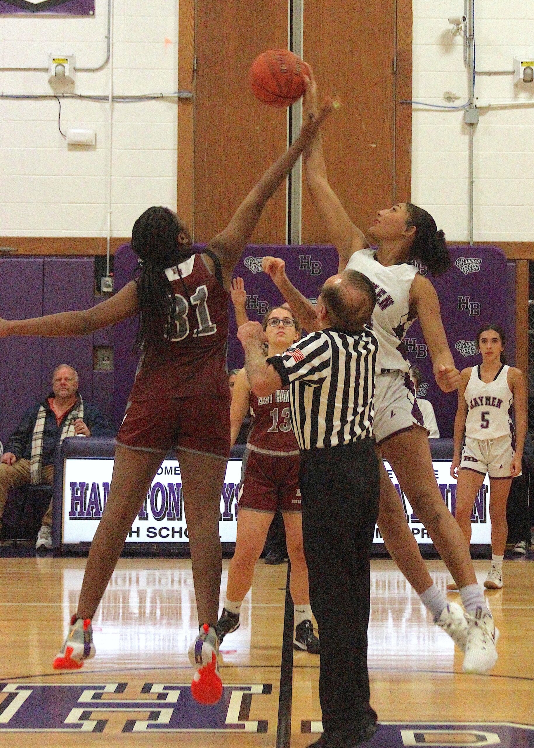 Sophomore Asha Pensa-Johnson reaches for the ball on the opening tipoff. DESIRÉE KEEGAN