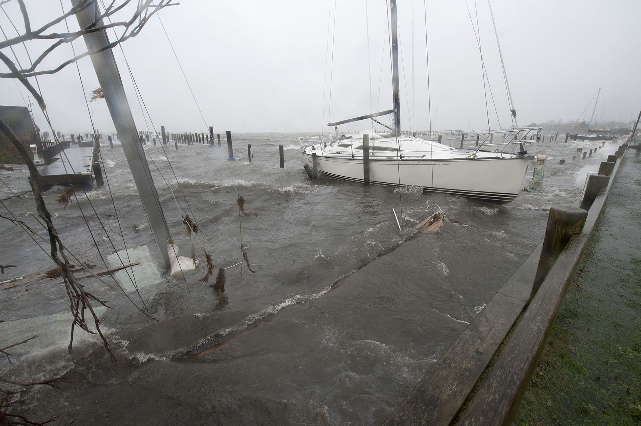 A  sailboat lay sunken at the west end of Marine Park in Sag Harbor during hurricane Sandy on Monday, October 29th, 2012.   MICHAEL HELLER