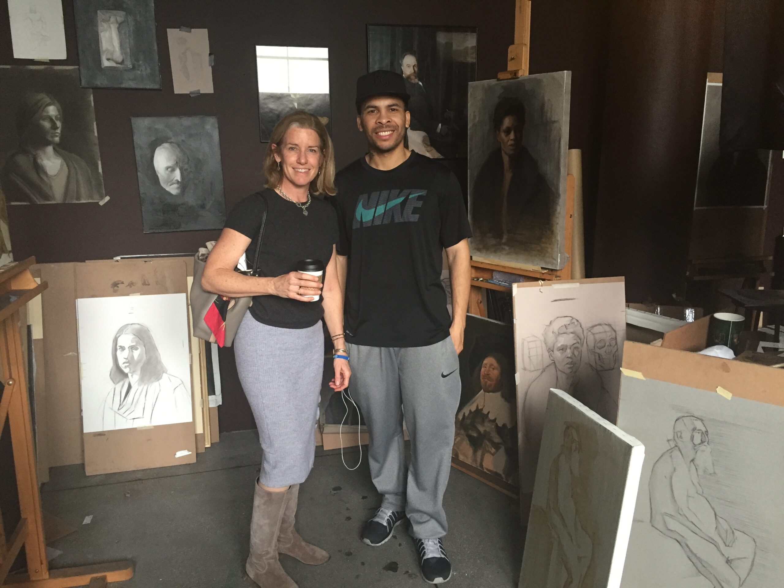 Laura Grenning and artist George Morton in Morton's studio at FAANY 2017. COURTESY GRENNING GALLERY