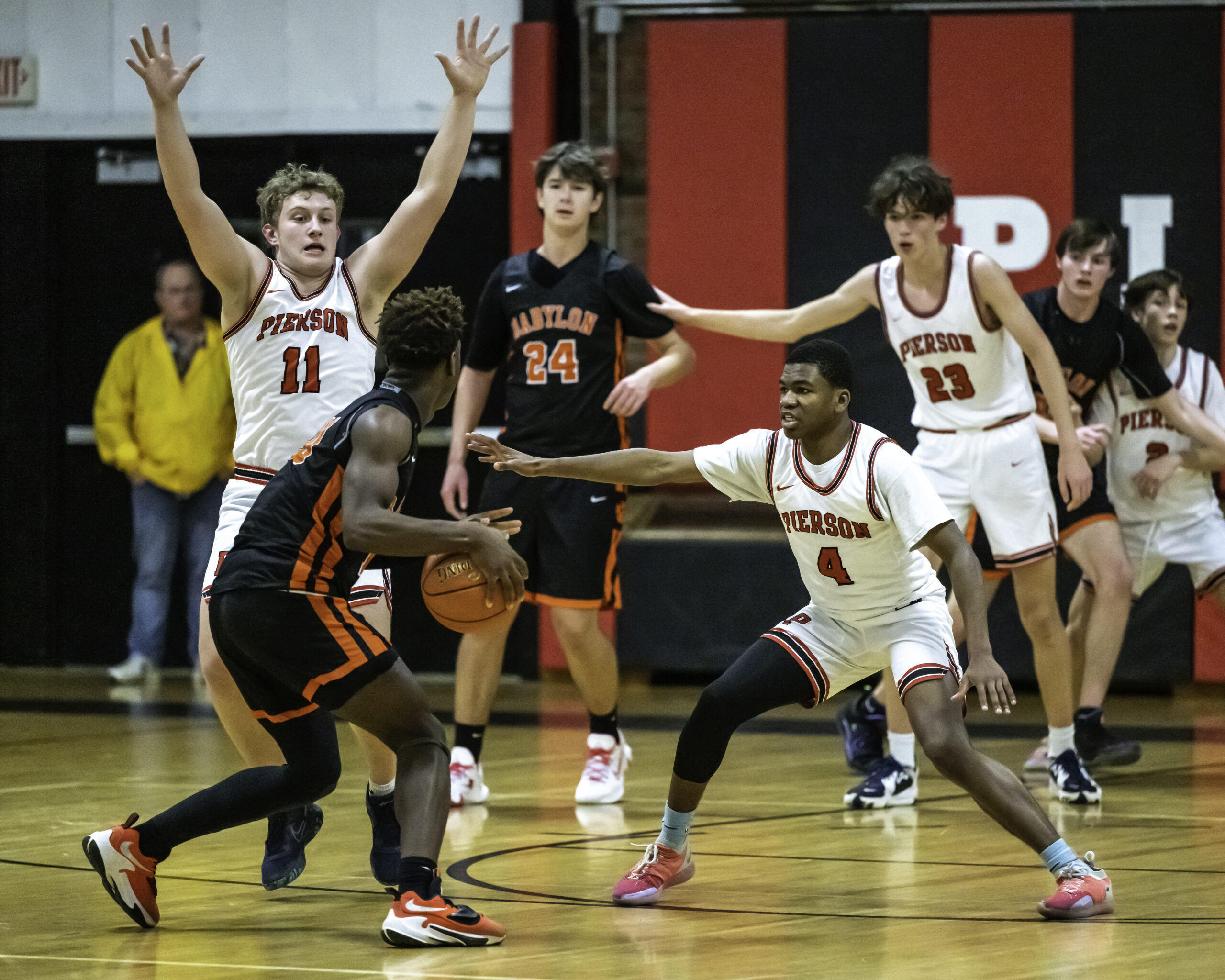 Senior Logan Hartstein and junior Keanu King defend against Babylon's Sincere McDougal. MARIANNE BARNETT