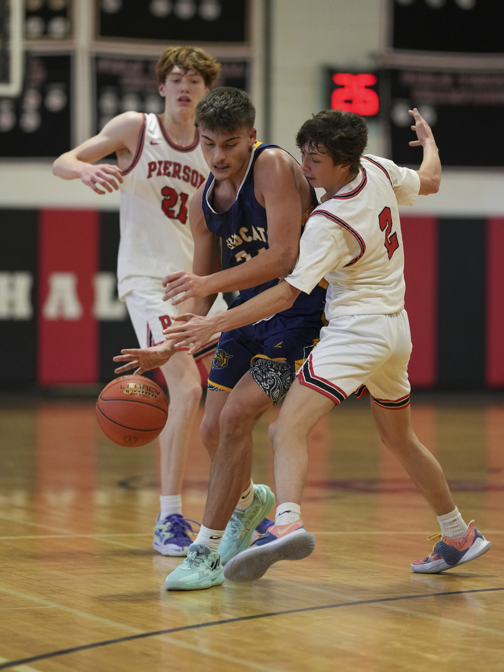 Whalers Luke Seltzer, left, and Dominick Mancino try to disrupt Shoreham's Anthony Osness.   RON ESPOSITO