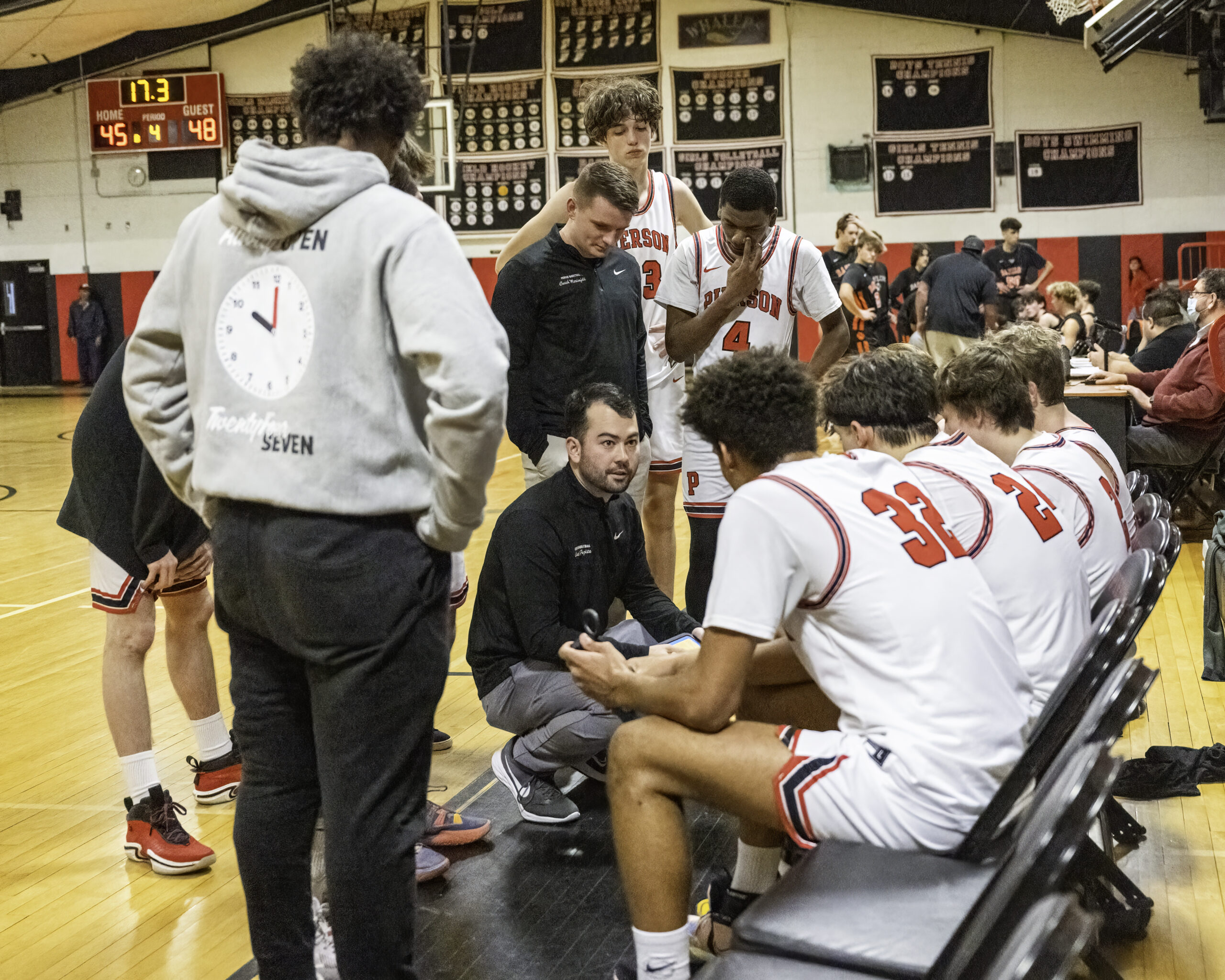 Pierson's boys basketball team listens to head coach Will Fujita as he draws up the next play during a timeout. MARIANNE BARNETT