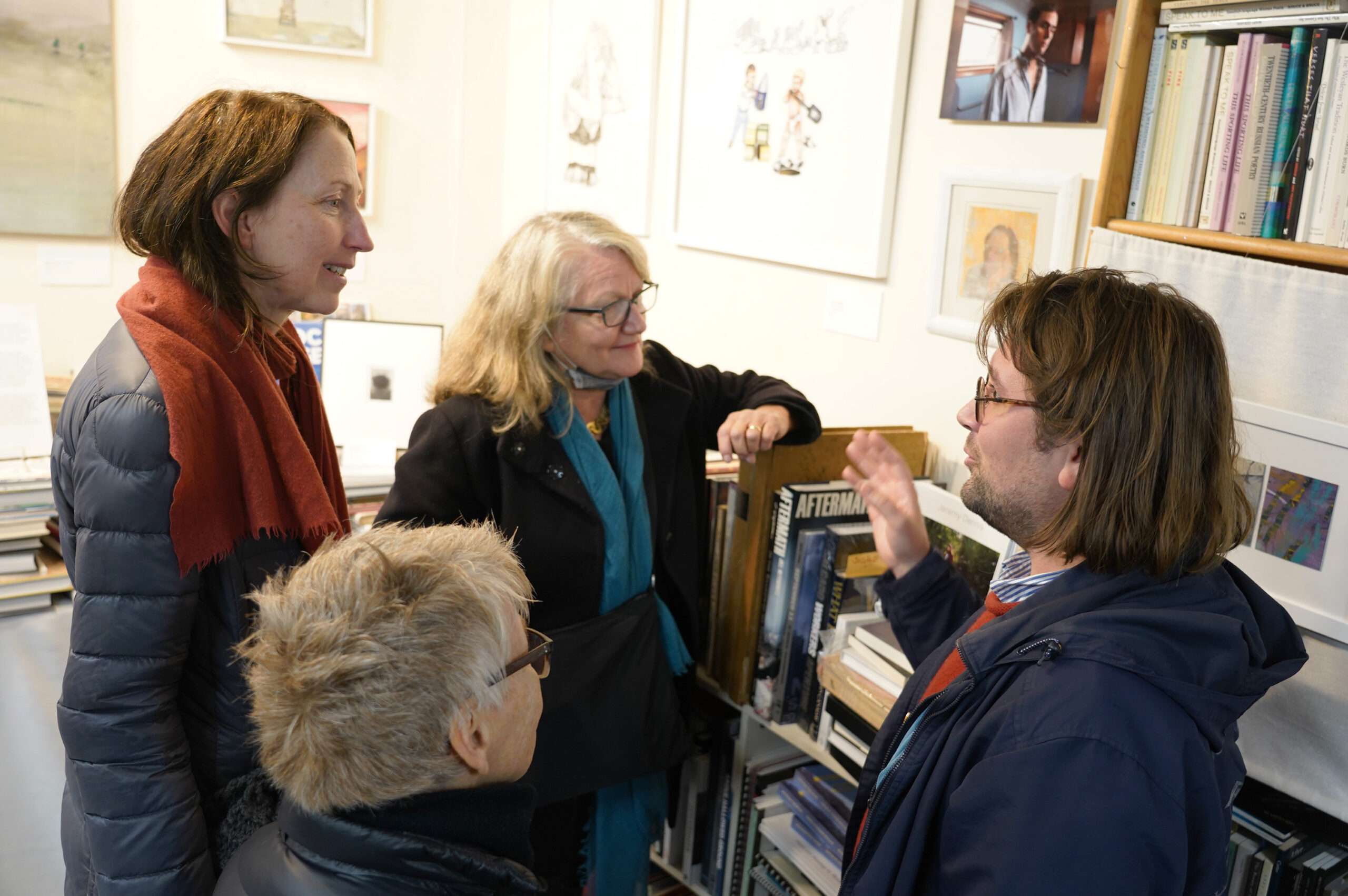 Roisin Batemen, Lucille Colin and Jennifer Cross with Joseph Cornell Saunders talking about his self -portrait at the November 26 opening of 
