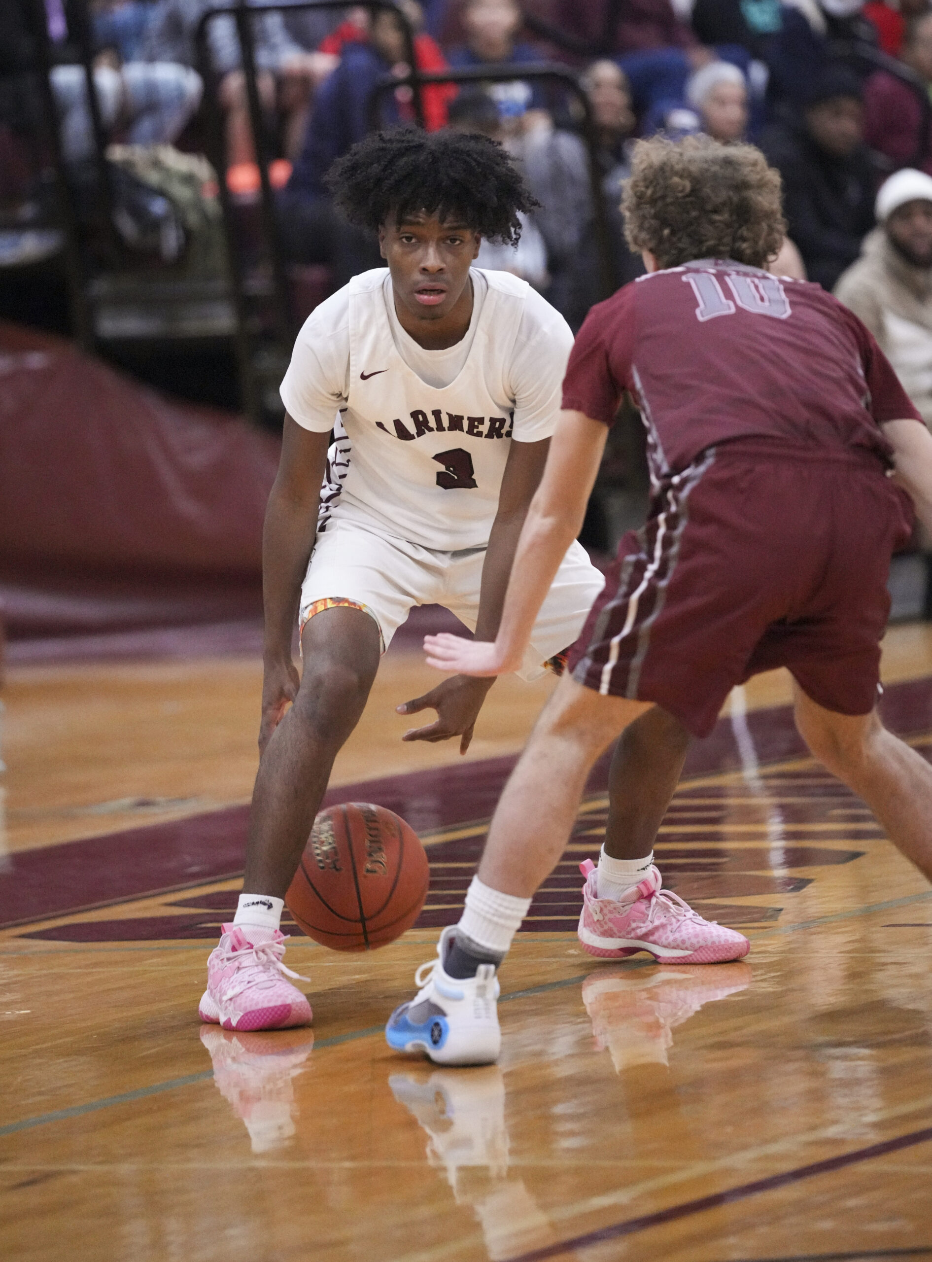 Southampton senior Derek Reed sizes up East Hampton senior Ben Zazula.   RON ESPOSITO