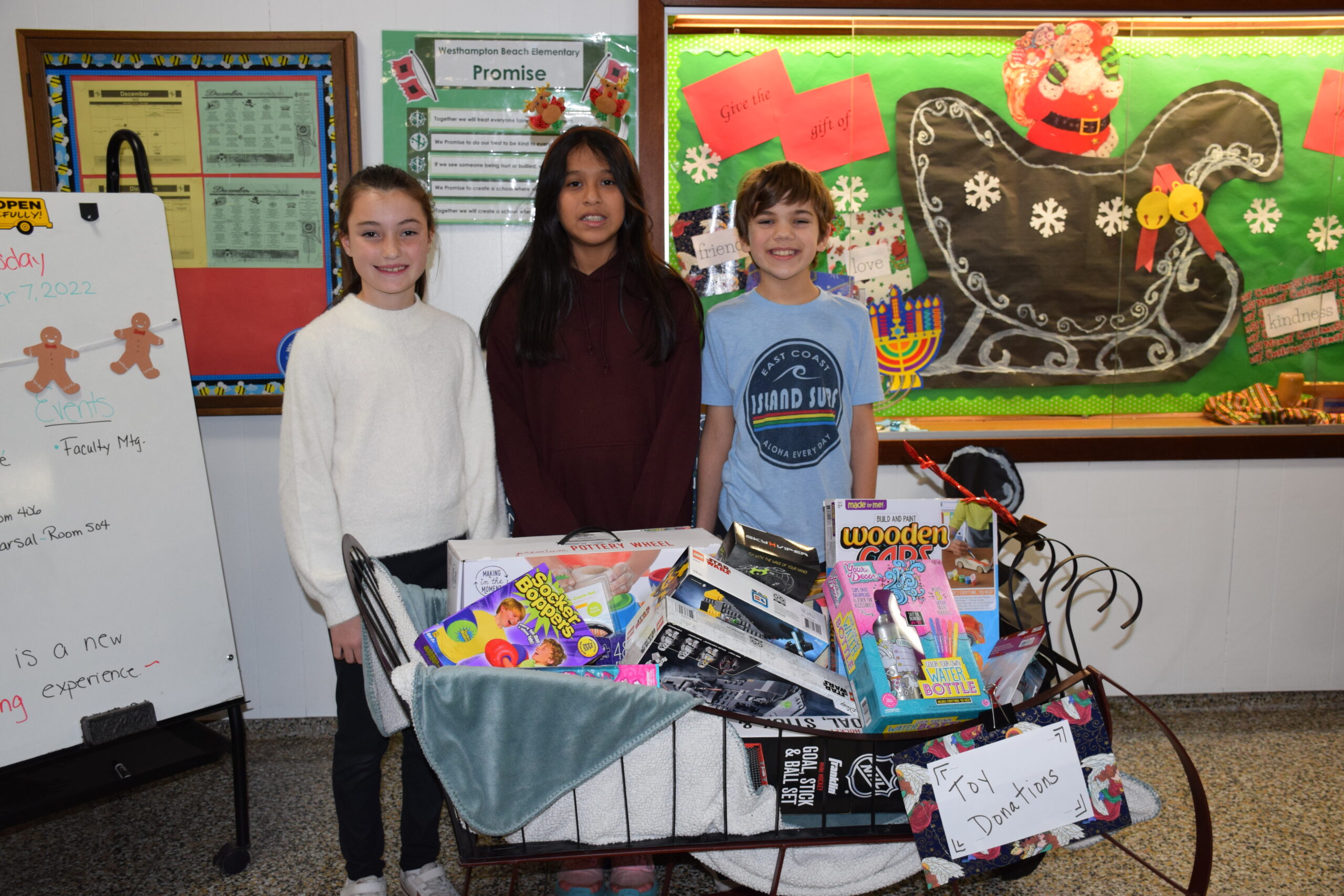 Members of the Westhampton Beach Elementary School Student Council, including from left, Molly Fay, Isabel Ixcoy and Evan Pereyra, have kicked off their annual holiday toy drive. The students created signs and collection
boxes with a goal to amass as many toys as possible during the month of December. All of
the toys will be donated to the Immaculate Conception Church in Westhampton Beach for
distribution to those in need. COURTESY WESTHAMPTON BEACH SCHOOL DISTRICT