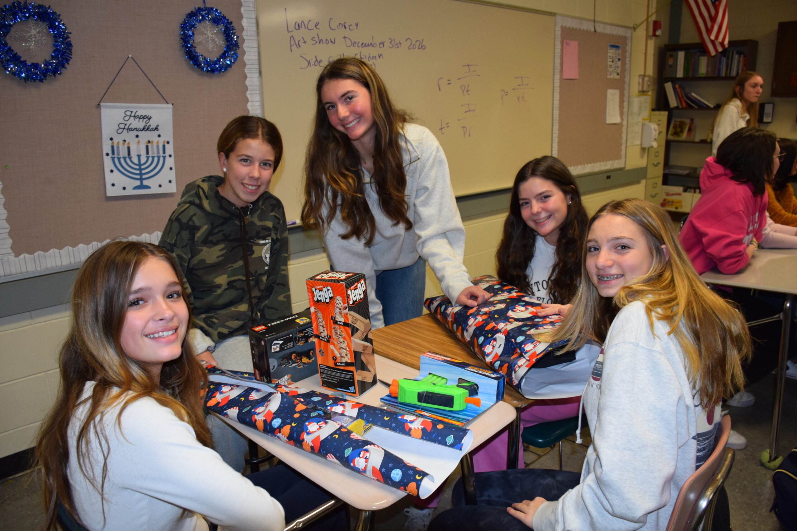 Westhampton Beach High School Key Club and Interact members are making the season bright for families in need and for their peers. Recently, they spent an afternoon wrapping gifts for their annual Adopt-A-Family holiday gift-giving fundraiser. All of the gifts will be donated to families in need. The members of the Key Club also spent time decorating the main lobby of their school to spread holiday cheer. COURTESY WESTHAMPTON BEACH SCHOOL DISTRICT