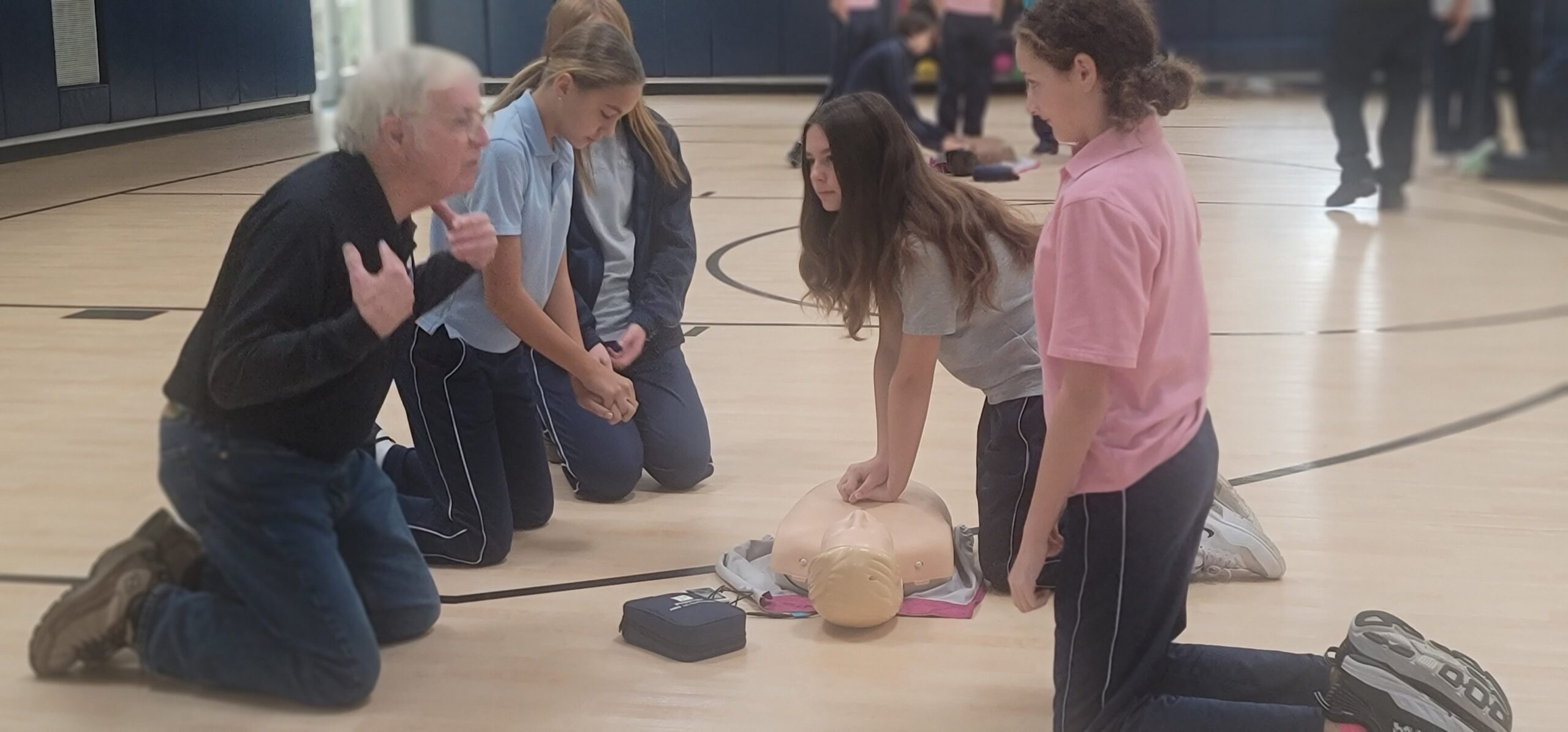 Students in Our Lady of the Hamptons Prep 7 health education class of Elyse Curro received instruction in CPR training with help from the  Southampton Village Ambulance, led by
Joseph Herley. COURTESY OUR LADY OF THE HAMPTONS