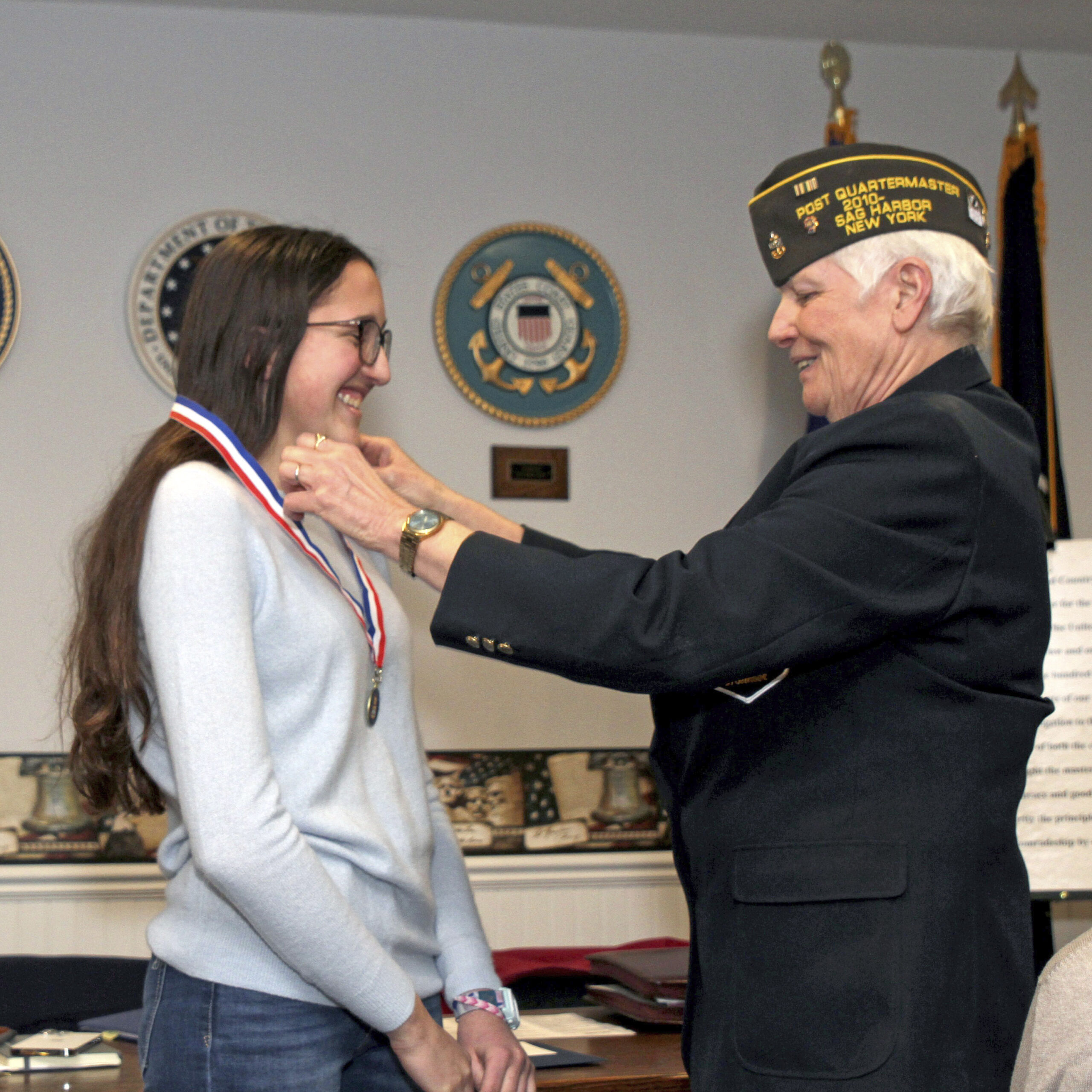 Sharon Lewis, Quartermaster, VFW Post 9082 of Sag Harbor, presents Pierson junior Isabelle Caplin with the  Post’s Voice of Democracy award on January 16 at the post.  Isabelle's entry has been forwarded to the next level NY District 11for consideration.  TOM KOCHIE