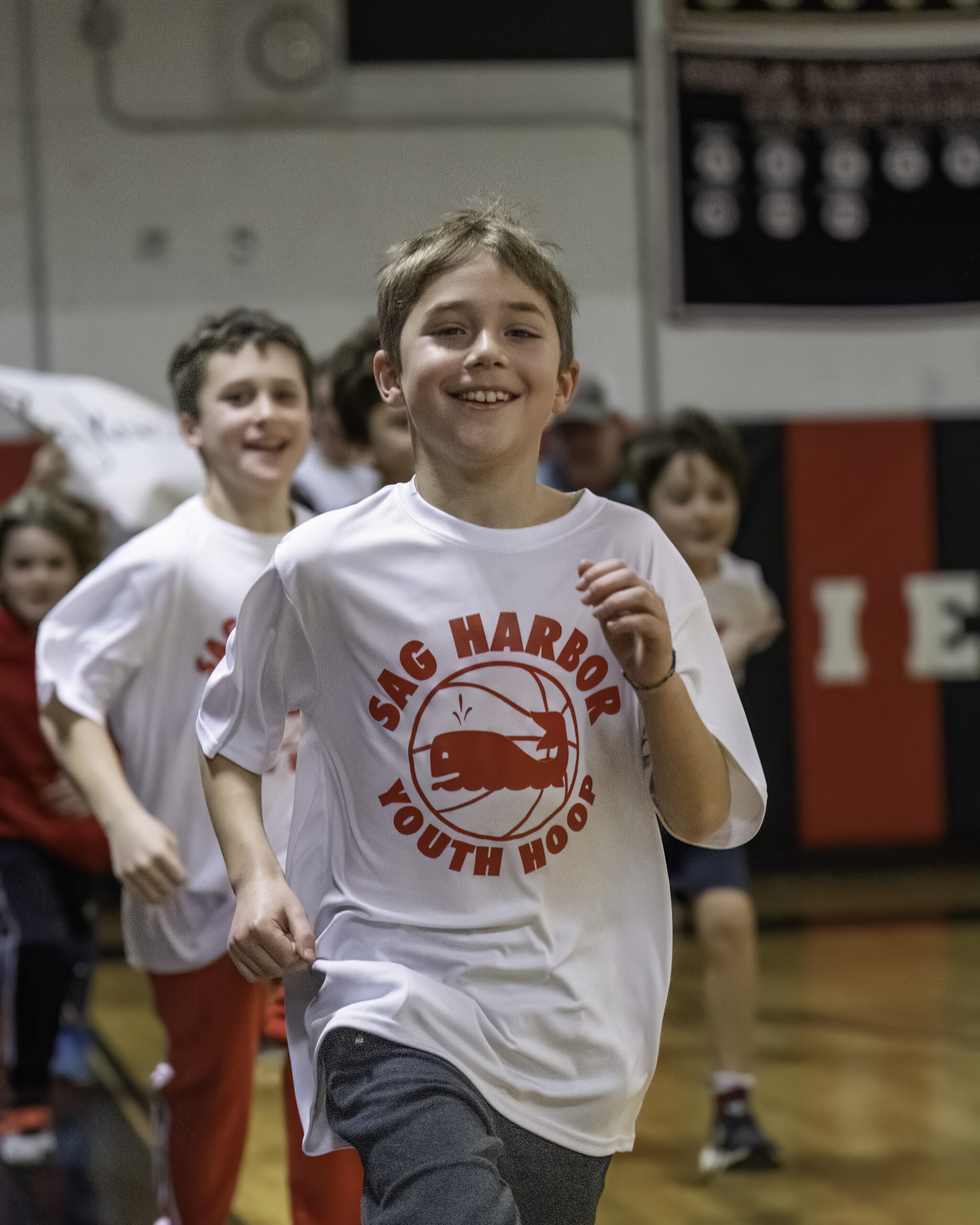 At halftime of the girls game, which preceded the boys game, each one of Sag Harbor Youth Hoop's basketball teams came out onto the court at Pierson High School.    MARIANNE BARNETT