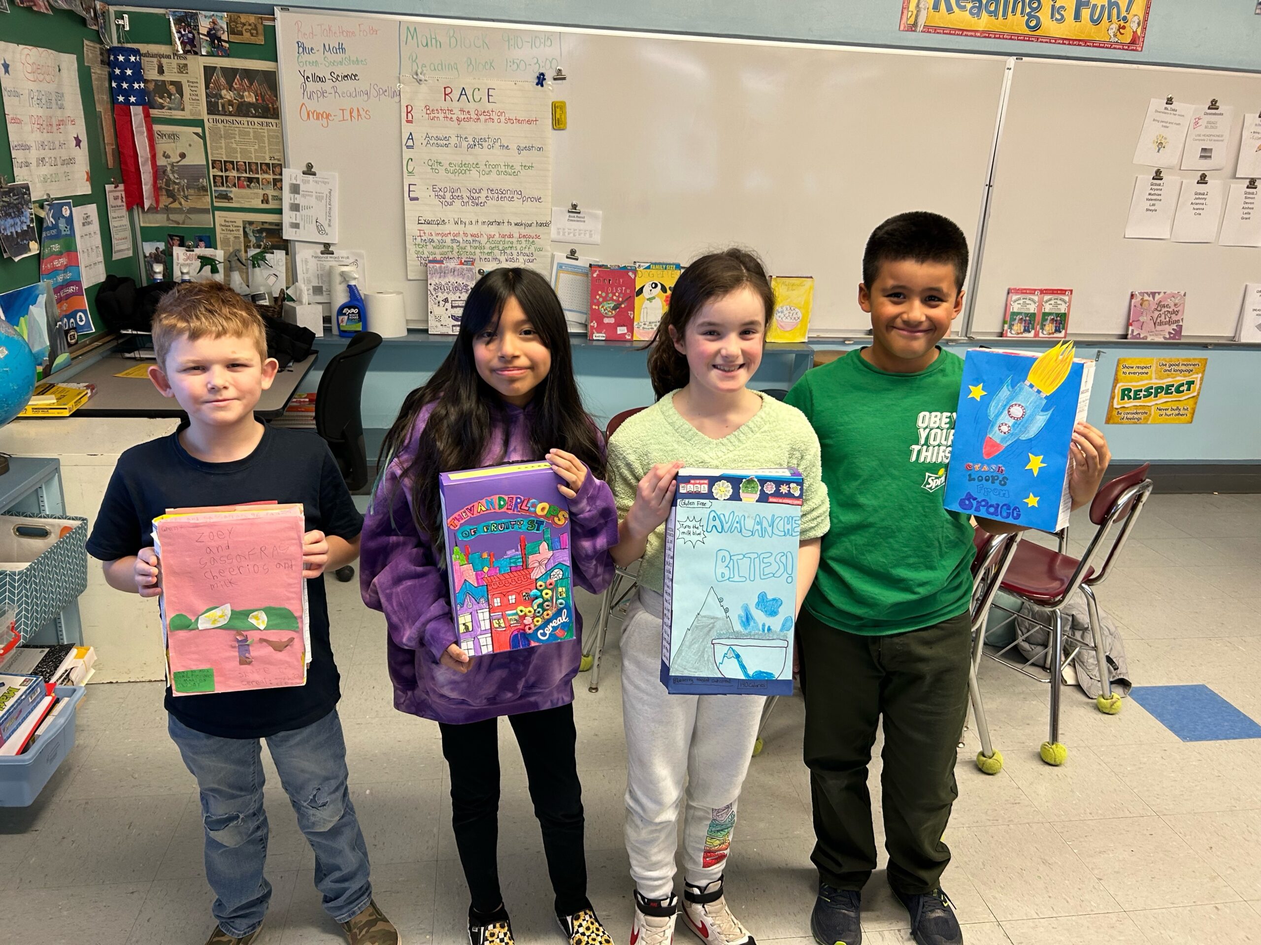 Hampton Bays Elementary School fourth grade students in Amy McNamara’s class recently created cereal box book reports as part of their fiction reading series. Each student came up with a unique name for their cereal based on the book they read, and all students presented their reports to the class. From left, Grant Kurz, Nicole Moranchel, Lilli Carlson and Simon O'Campo with their project. COURTESY HAMPTON BAYS SCHOOL DISTRICT
