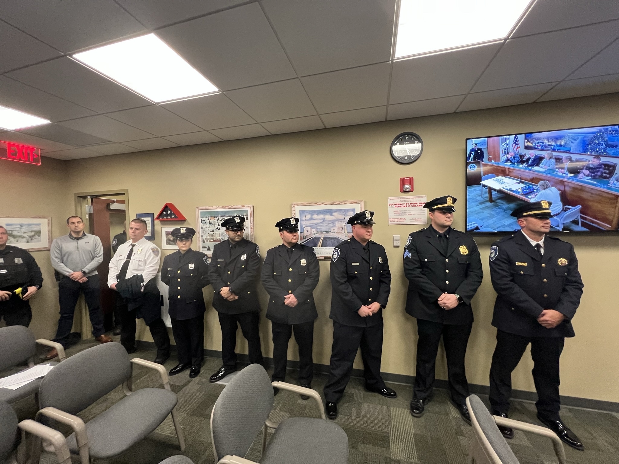 Police officers line the halls of the Westhampton Beach Village Hall meeting room to mark the promotion of Sergeant Kevin Klokel. BILL SUTTON