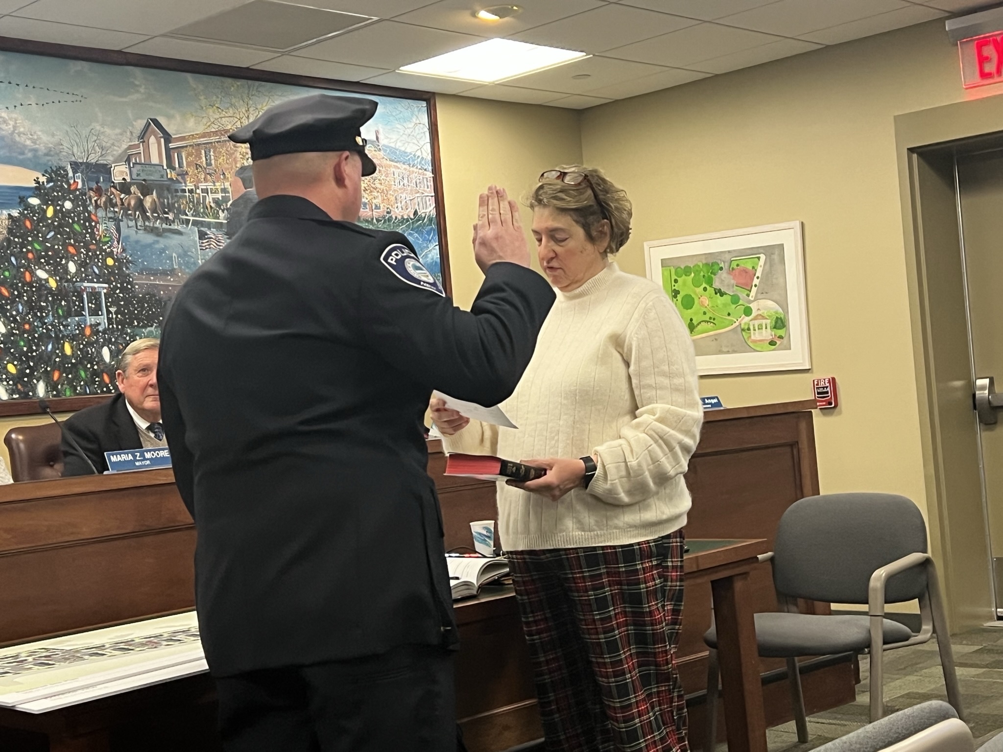 Sergeant Kevin Klokel is sworn in by Village Clerk Elizabeth Lindtvit at the January 5 board meeting. BILL SUTTON