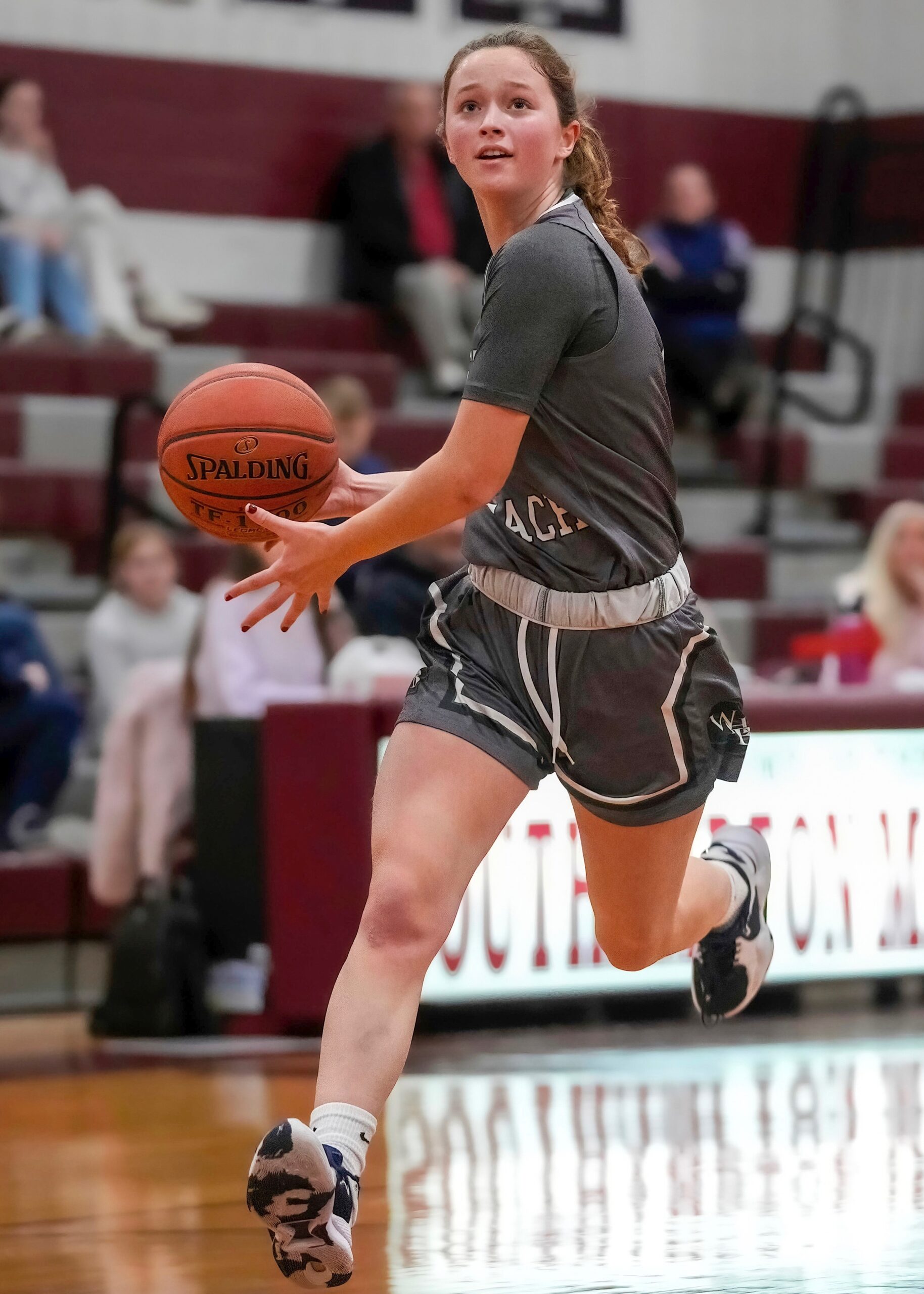 Westhampton Beach junior Jane Atkinson drives to the basket. RON ESPOSITO