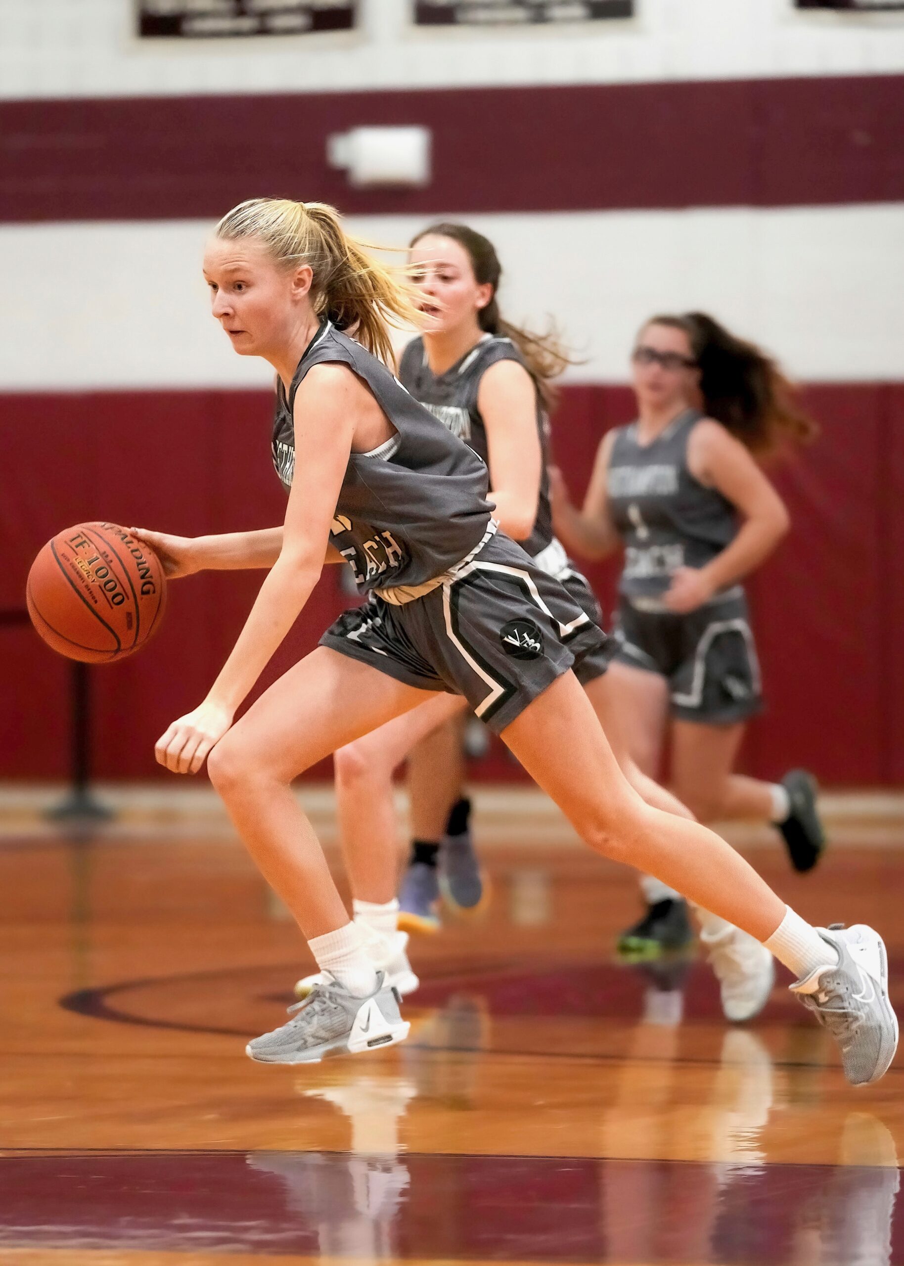 Westhampton Beach eighth-grader Kate Sweet moves the ball across the court. RON ESPOSITO