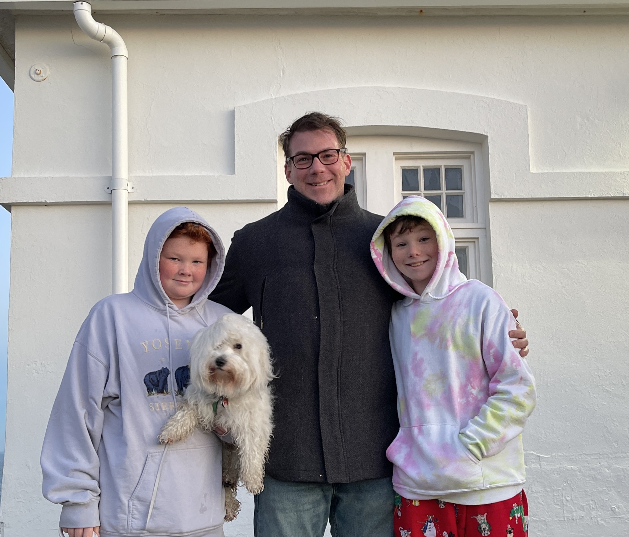 Sean McLean and his sons Euan and Lachlan, with Bodhi came from Southampton to the Montauk Point Lighthouse to see the sun rise over the Atlantic on the first day of 2023.    KATHERINE C.H.E.