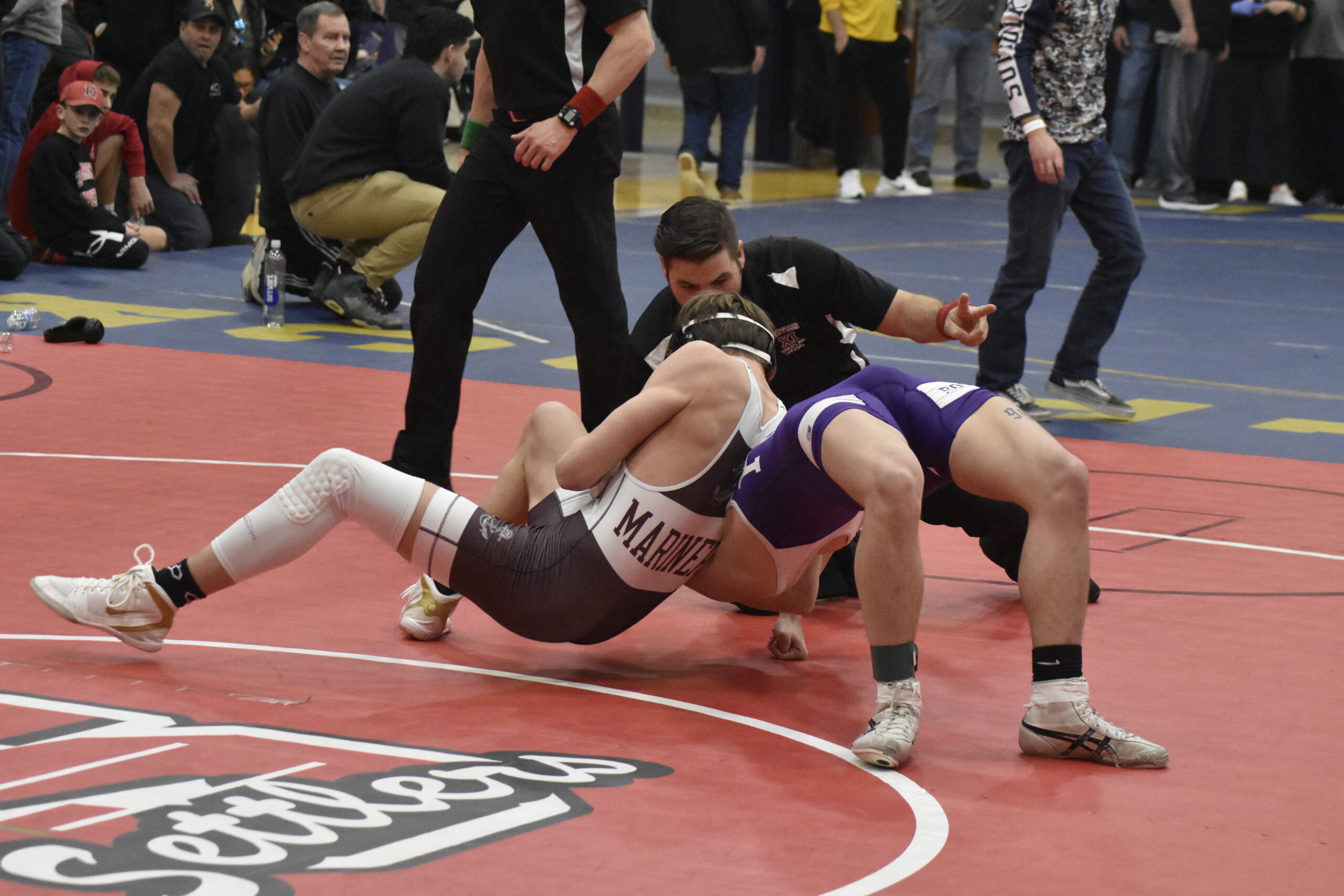 Southampton's Hudson Fox nearly pinned Port Jeff's Liam Rogers in the county semifinal.   DREW BUDD