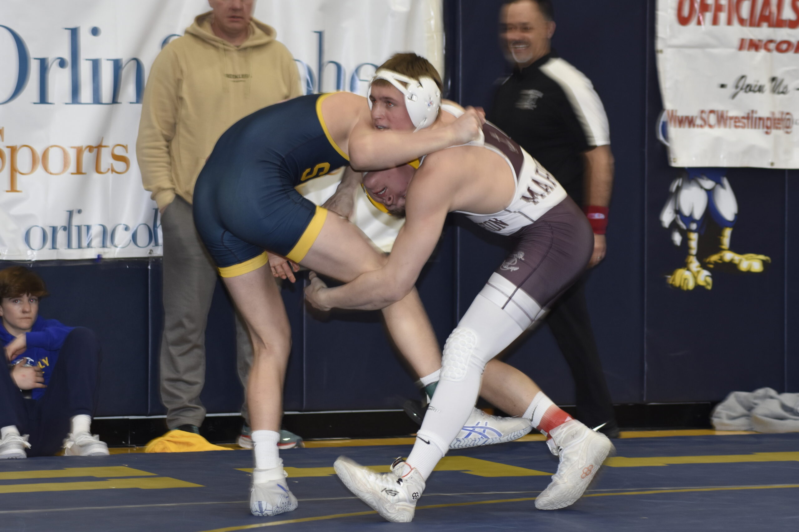 Southampton's Cole Fox locks up with Shoreham-Wading River's Nate Spuhler in the consolation finals.    DREW BUDD