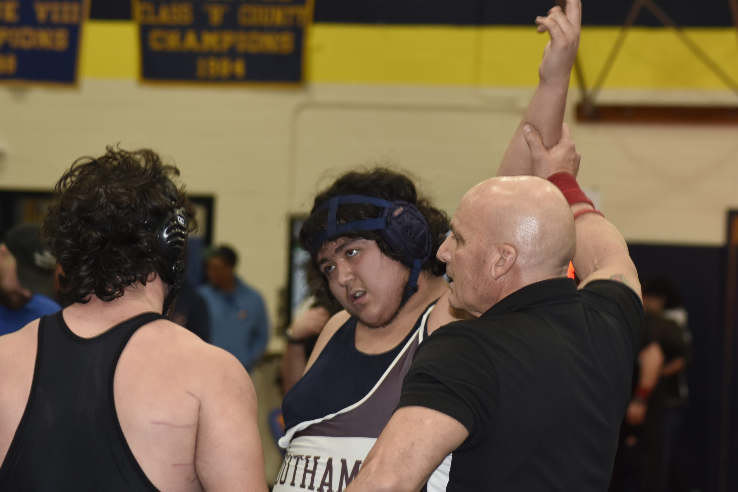 Southampton's David Castillo gets his arm raised after placing third in the county.   DREW BUDD