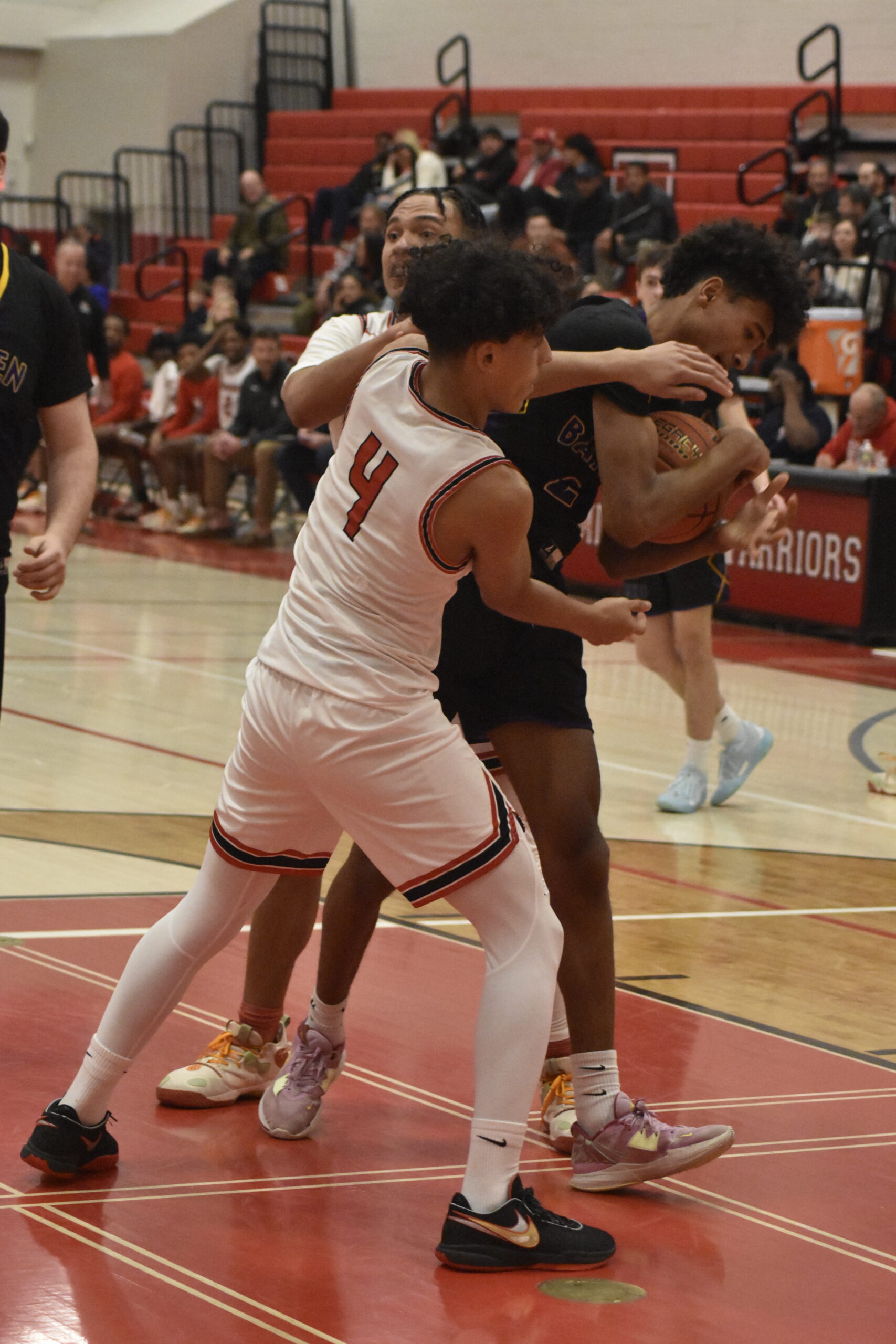 Hampton Bays senior Kazmin Pensa-Johnson tries to steal the ball.    DREW BUDD