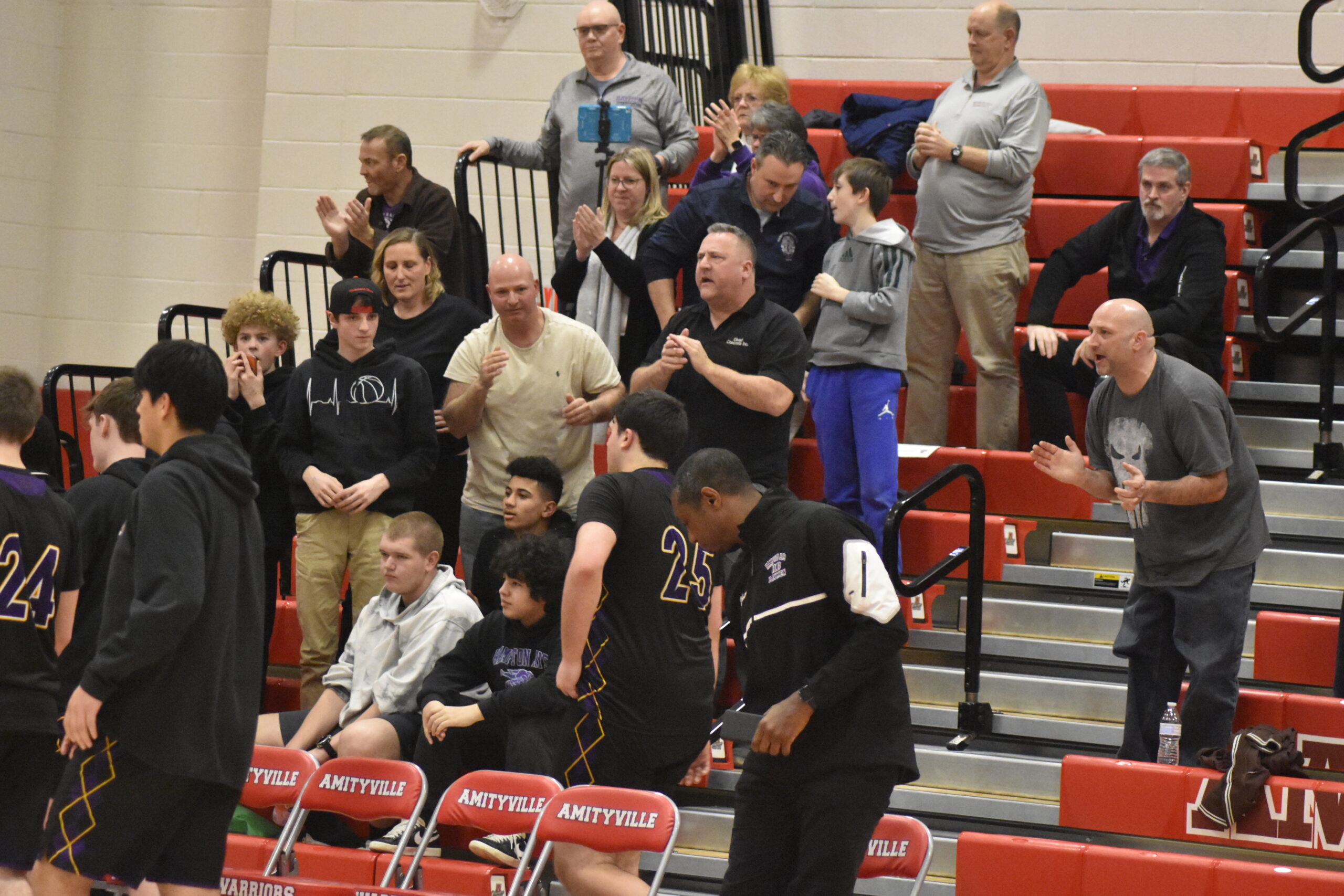 Hampton Bays fans traveled an hour to Amityville to cheer on their team on Monday evening.   DREW BUDD