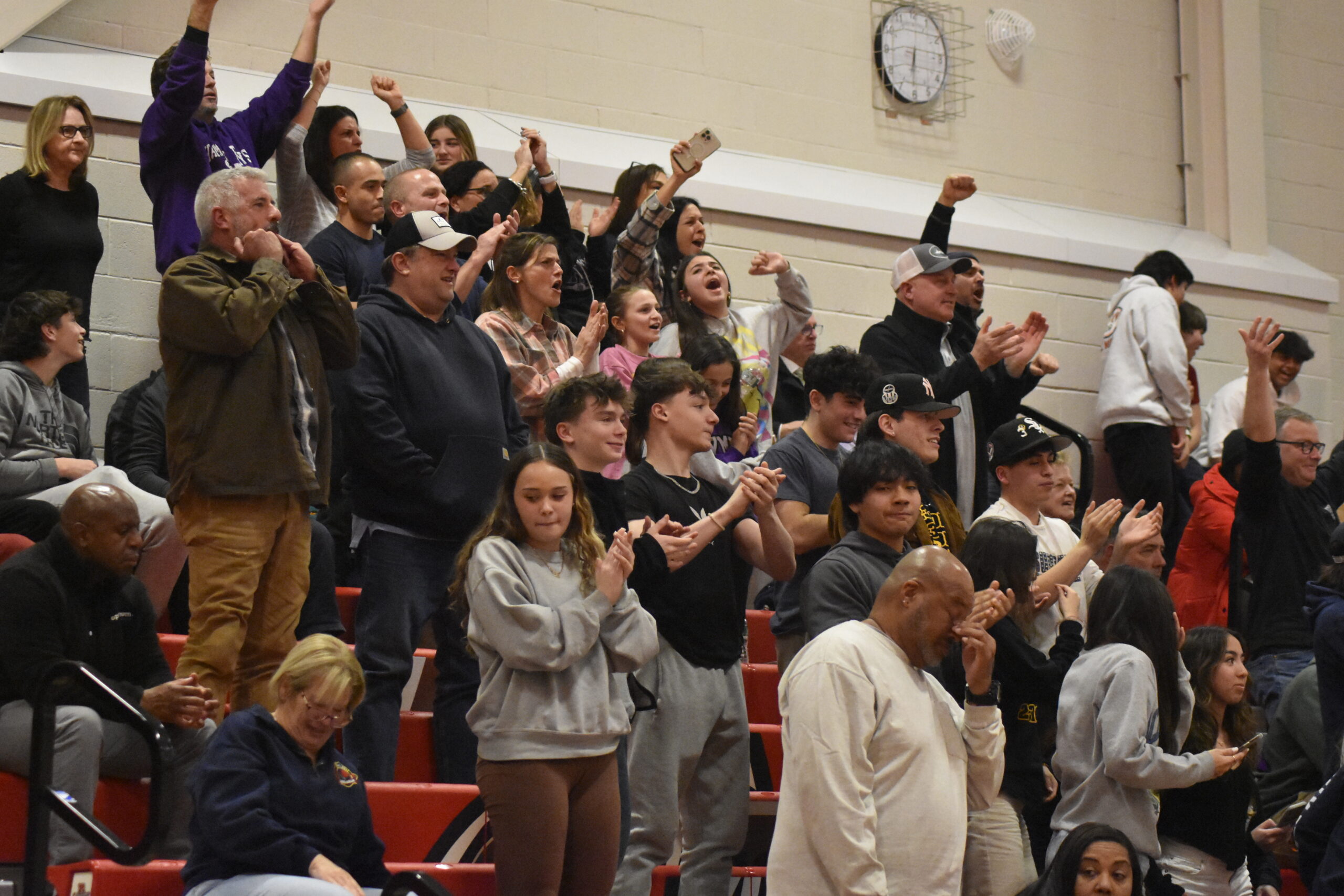 The Hampton Bays crowd tries to rally its team late in Monday's playoff contest.    DREW BUDD