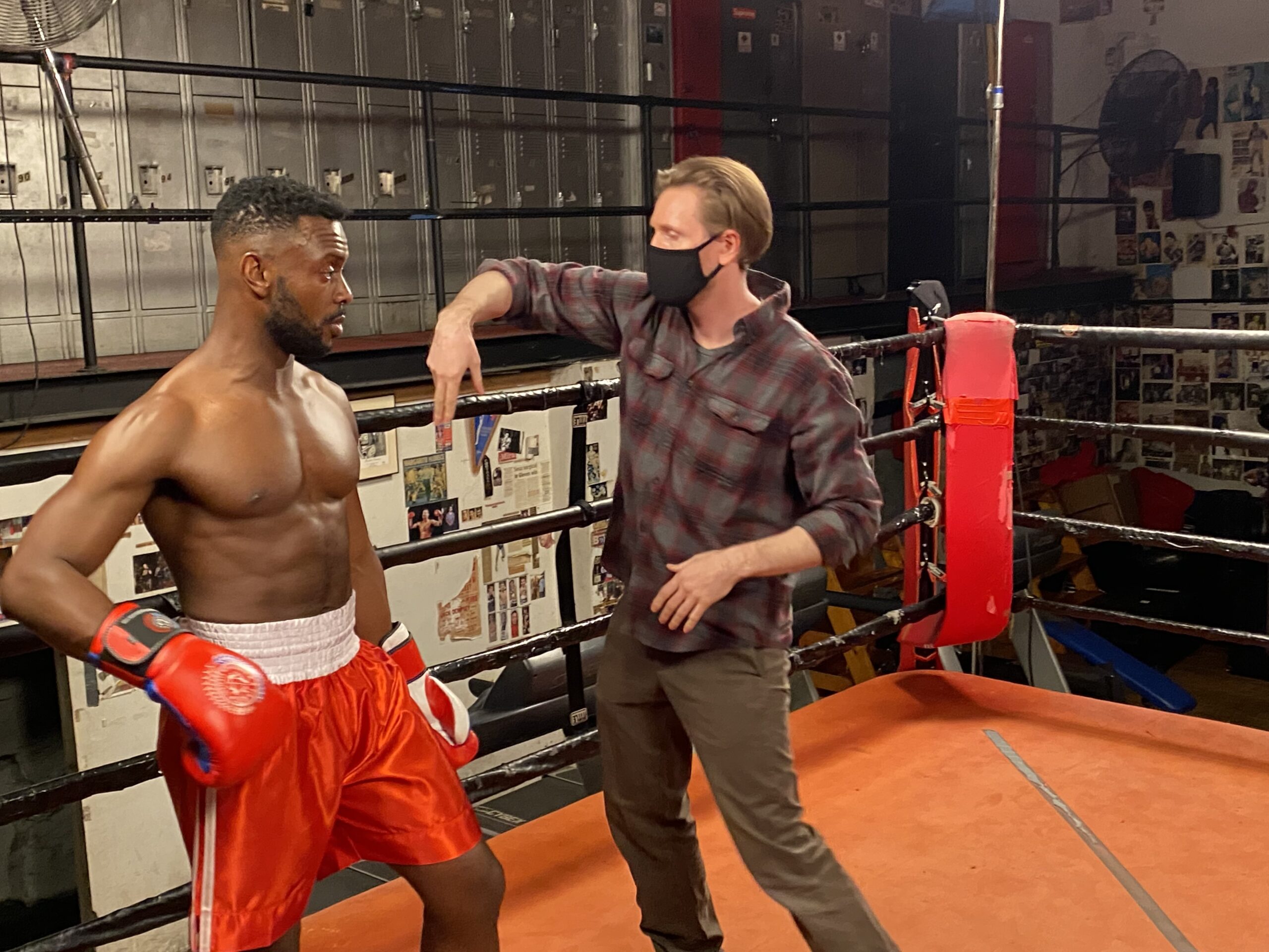 Fight director Rick Sordelet, in mask, working with a boxer in a music video. COURTESY RICK SORDELET