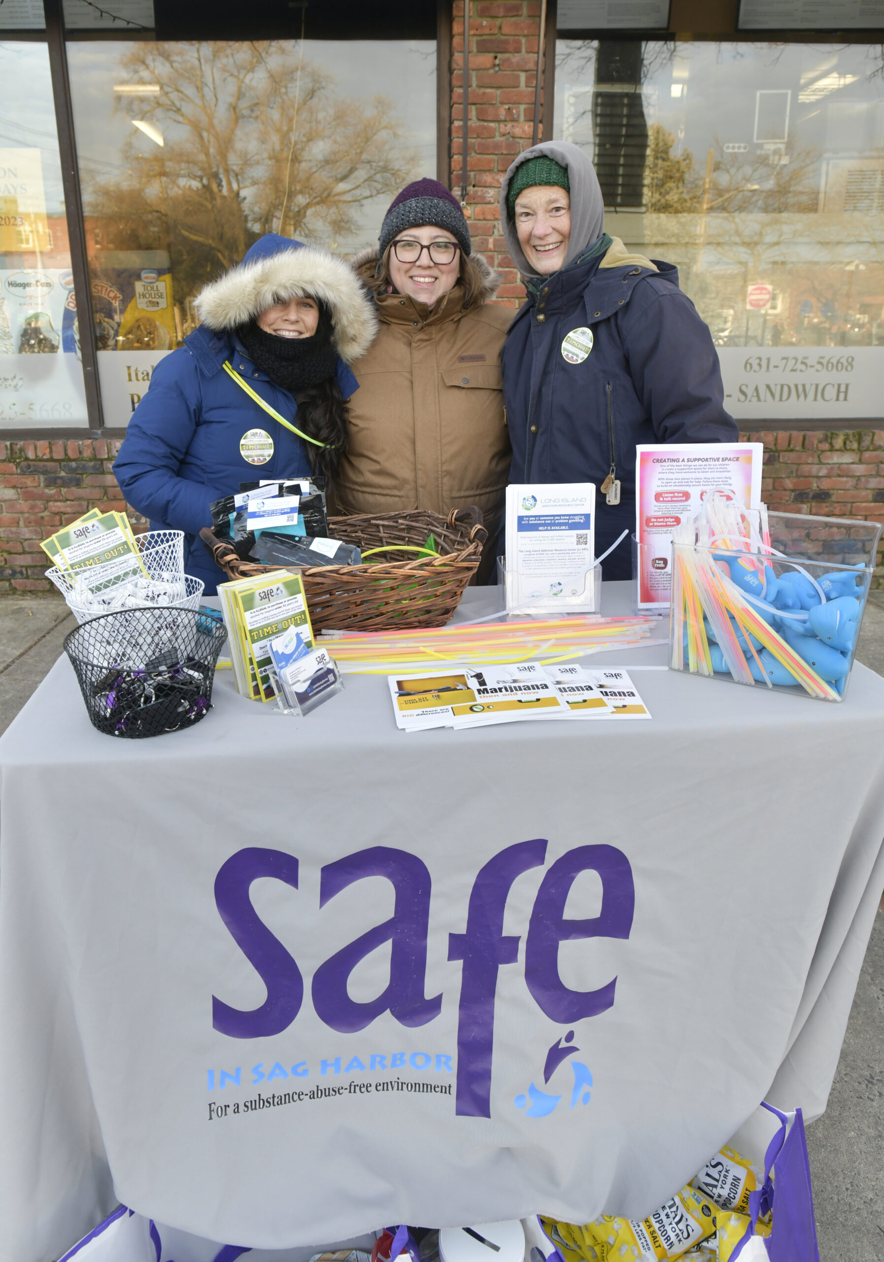 Kelly Dodds, Alana Urbont Marino and Cheryl 
Rozzi of Safe In Sag Harbor brave the cold on Saturday at HarborFrost to give out information on their organization. For more info go to SAFEinSagHarbor.org   DANA SHAW