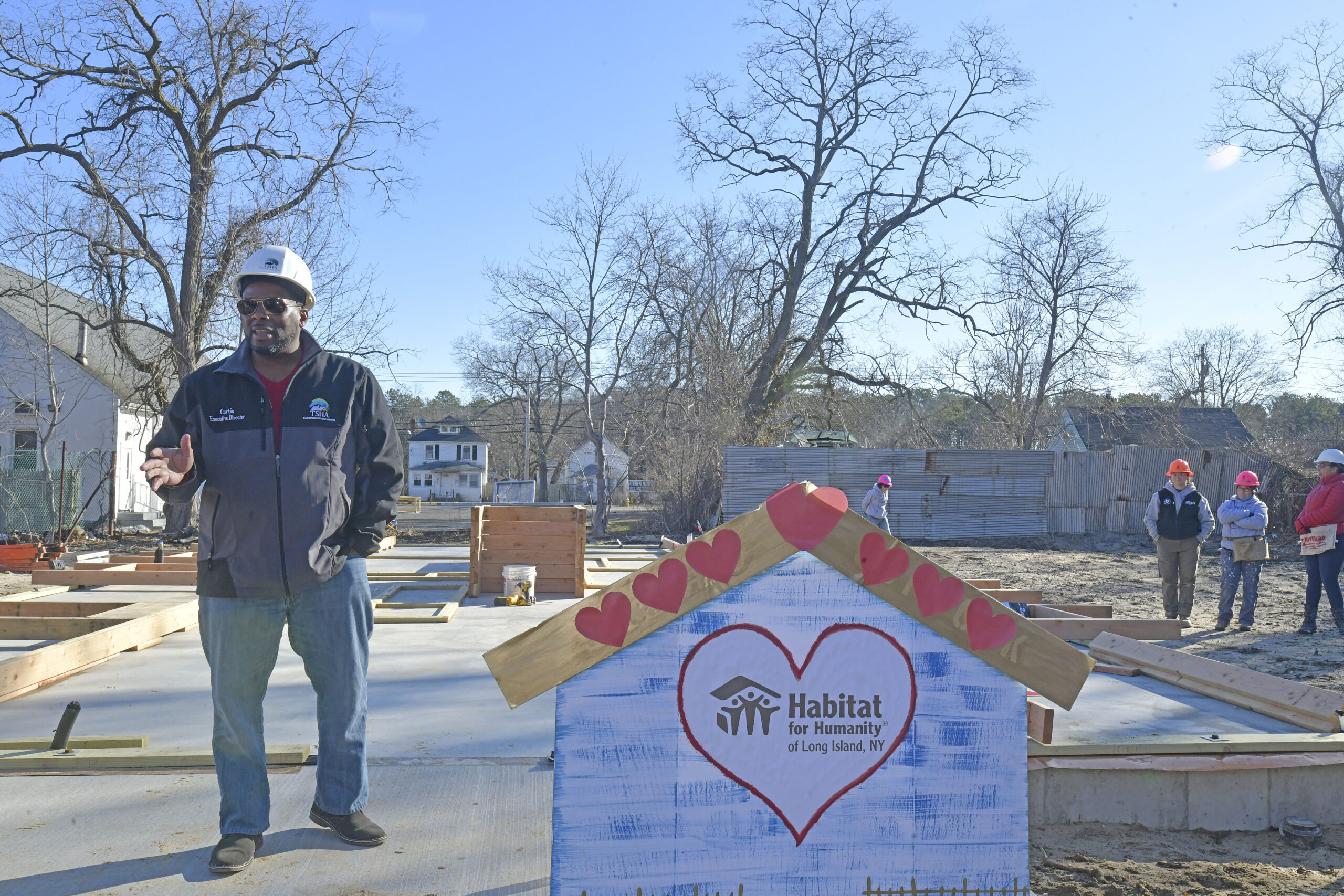 Executive Director of the Southampton Town Housing Authority Curtis Highsmith Jr. at the wall raising at the the Habitat for Humanity house on Vail Avenue in Riverside on Tuesday morning.  DANA SHAW