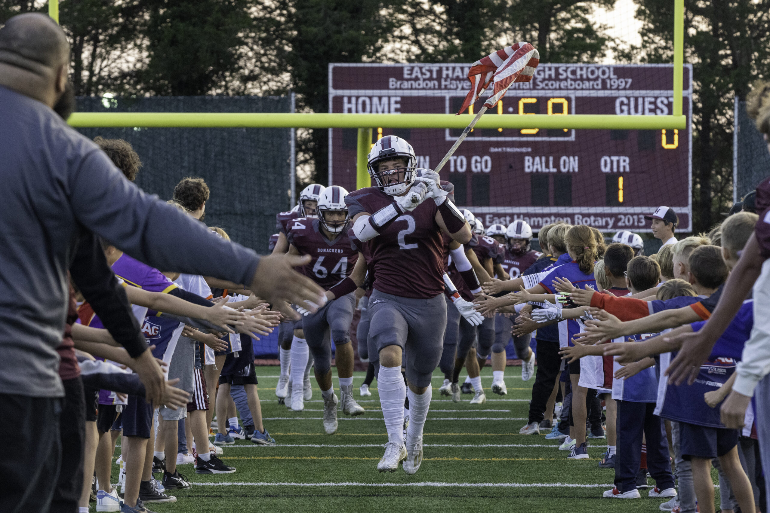 Finn Byrnes led the Bonackers onto the field for their homecoming game this past fall.   RON ESPOSITO