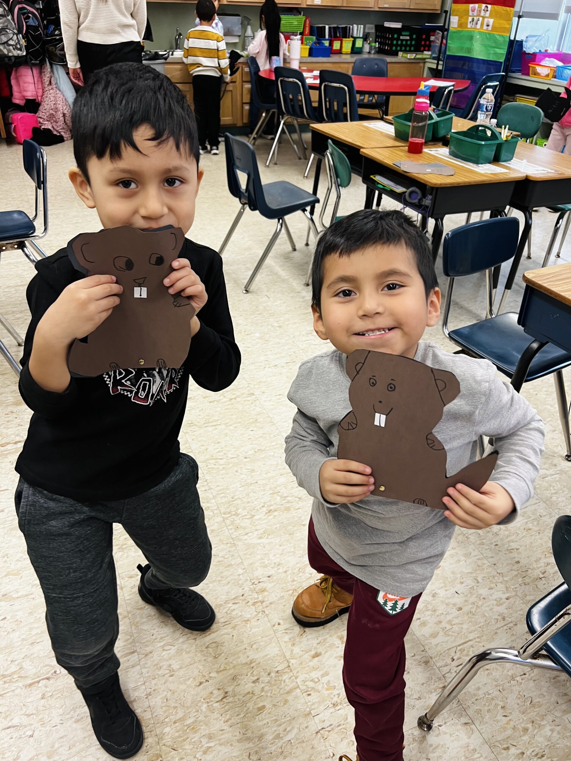 In observance of Groundhog Day, Hampton Bays Elementary School first grade students in Krista Savino’s class, including Matias Chimbo, left,  and Giancarlos Gomez. watched Punxsutawney Phil make his 2023 weather prediction and then made their own paper groundhogs with shadows. They also made predictions the day before Groundhog Day and designed a bar graph to chart them. COURTESY HAMPTON BAYS SCHOOL DISTRICT