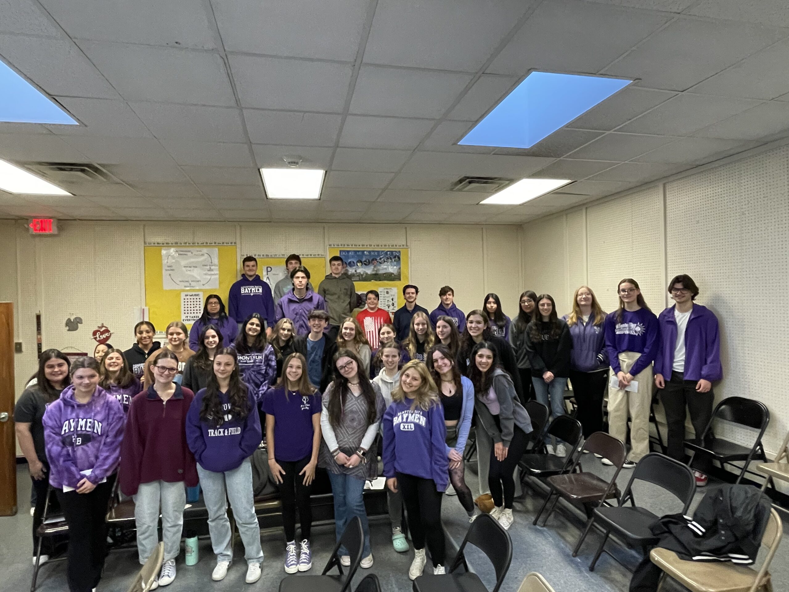 To raise awareness for mental health and suicide prevention, the members of the Hampton Bays High School Tri-M Music Honor Society promoted P.S. I Love You Day on February 10. They wrote notes of encouragement and placed them on the lockers of their peers and distributed hundreds of letters that students had written to one another as a reminder that they are loved and cared about. They also wore purple to bring awareness to the cause. COURTESY HAMPTON BAYS SCHOOL DISTRICT