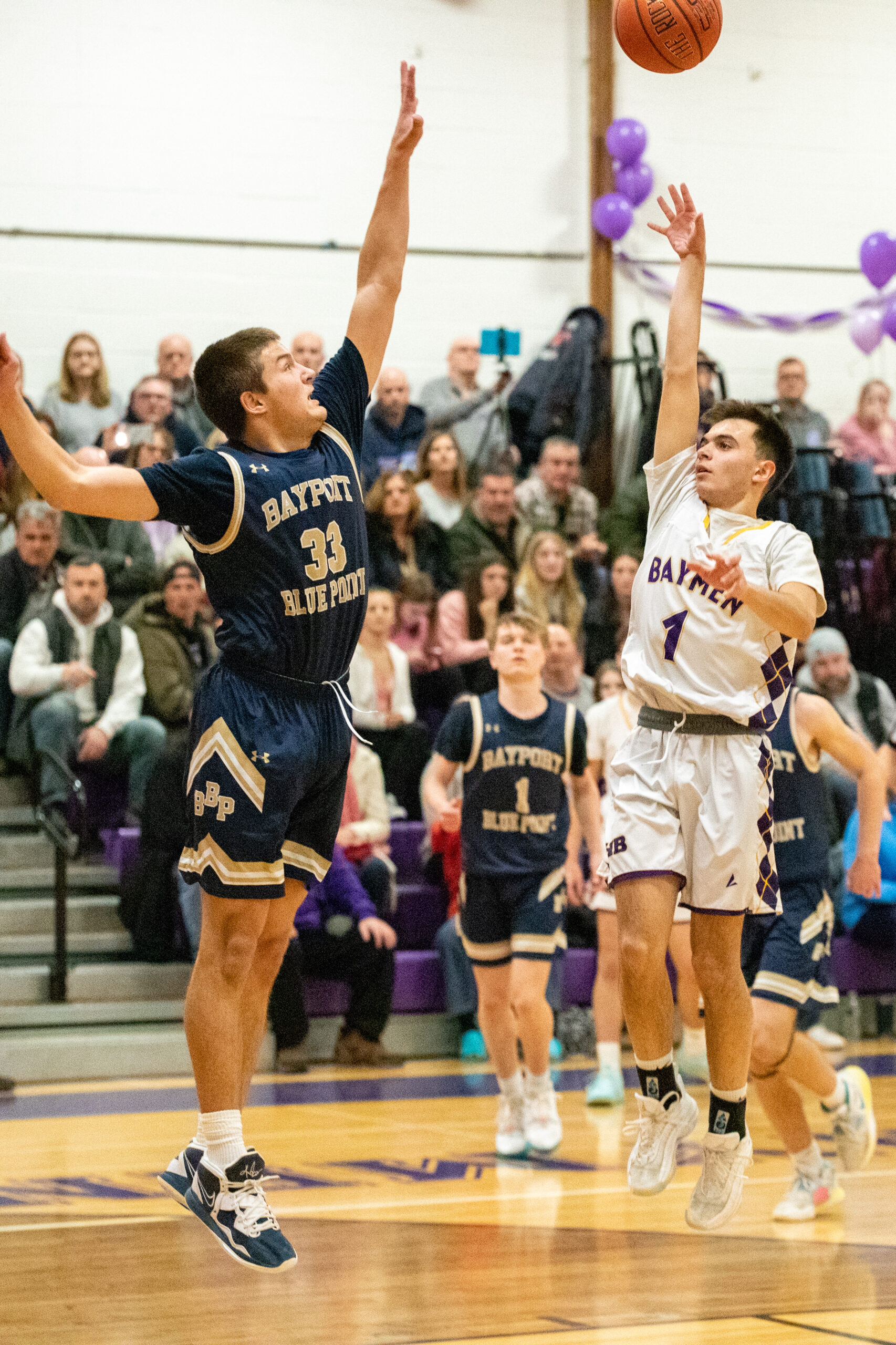 Senior guard Gianni Scotto shoots over a block attempt. MICHAEL O'CONNOR