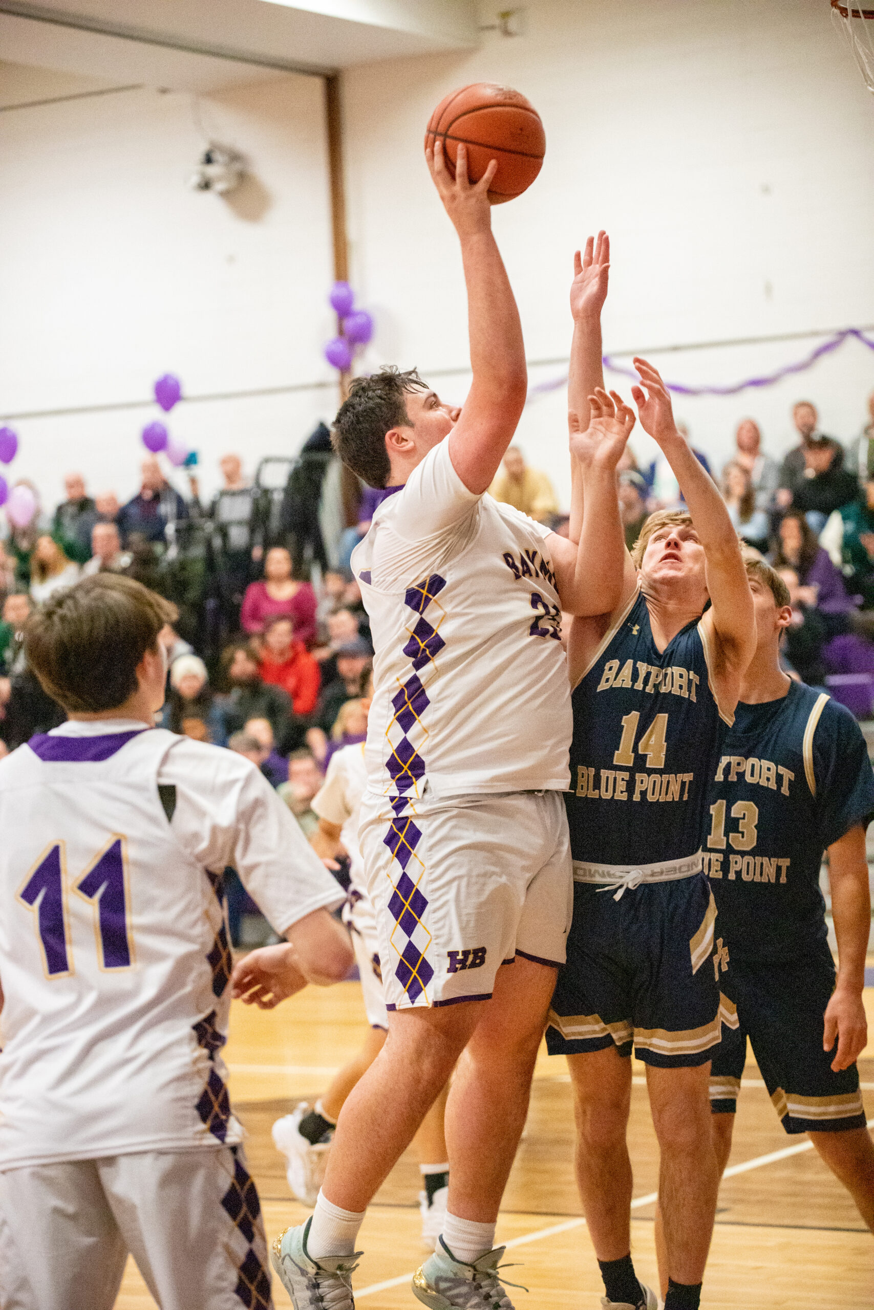 Junior forward Isaiah Lattanzio scores on a layup. MICHAEL O'CONNOR