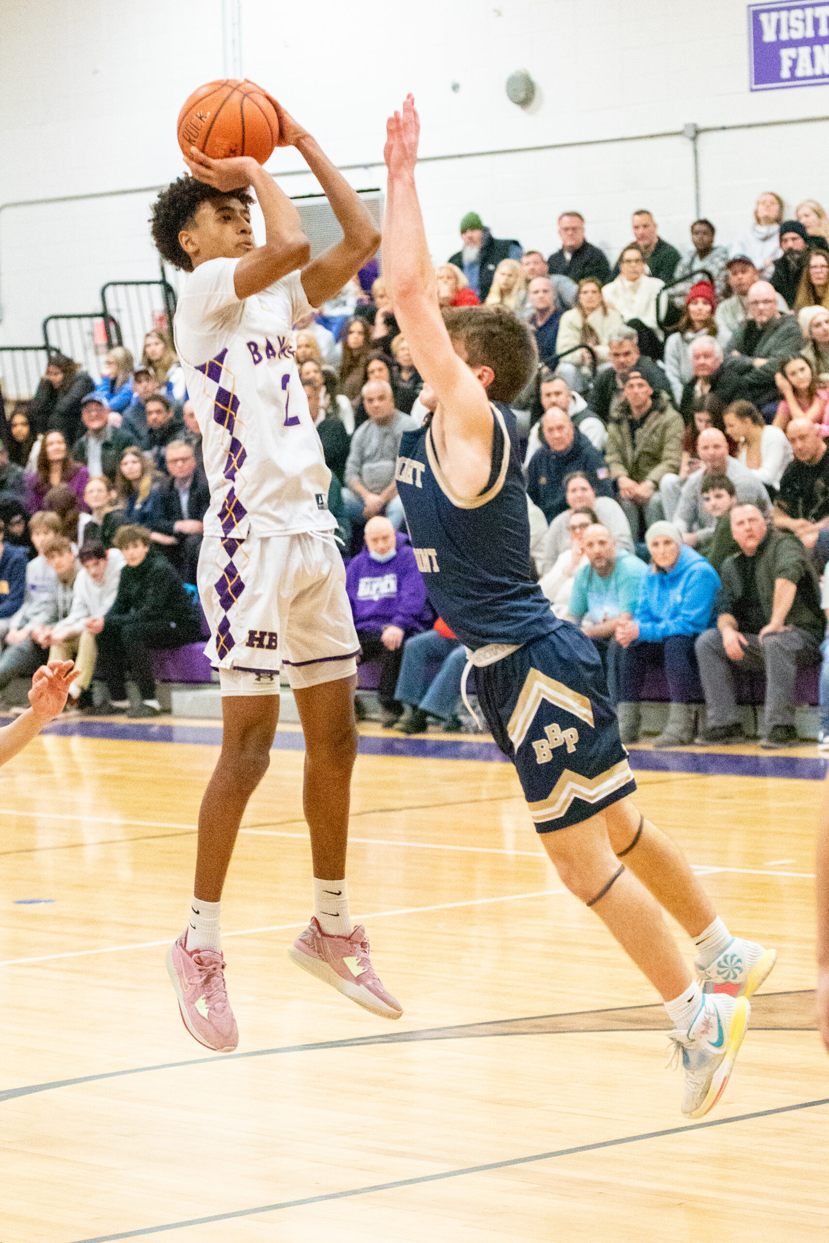 Senior guard Kazmin Pensa-Johnson lets a jump-shot fly over Bayport-Blue Point's Tully Campbell. MICHAEL O'CONNOR