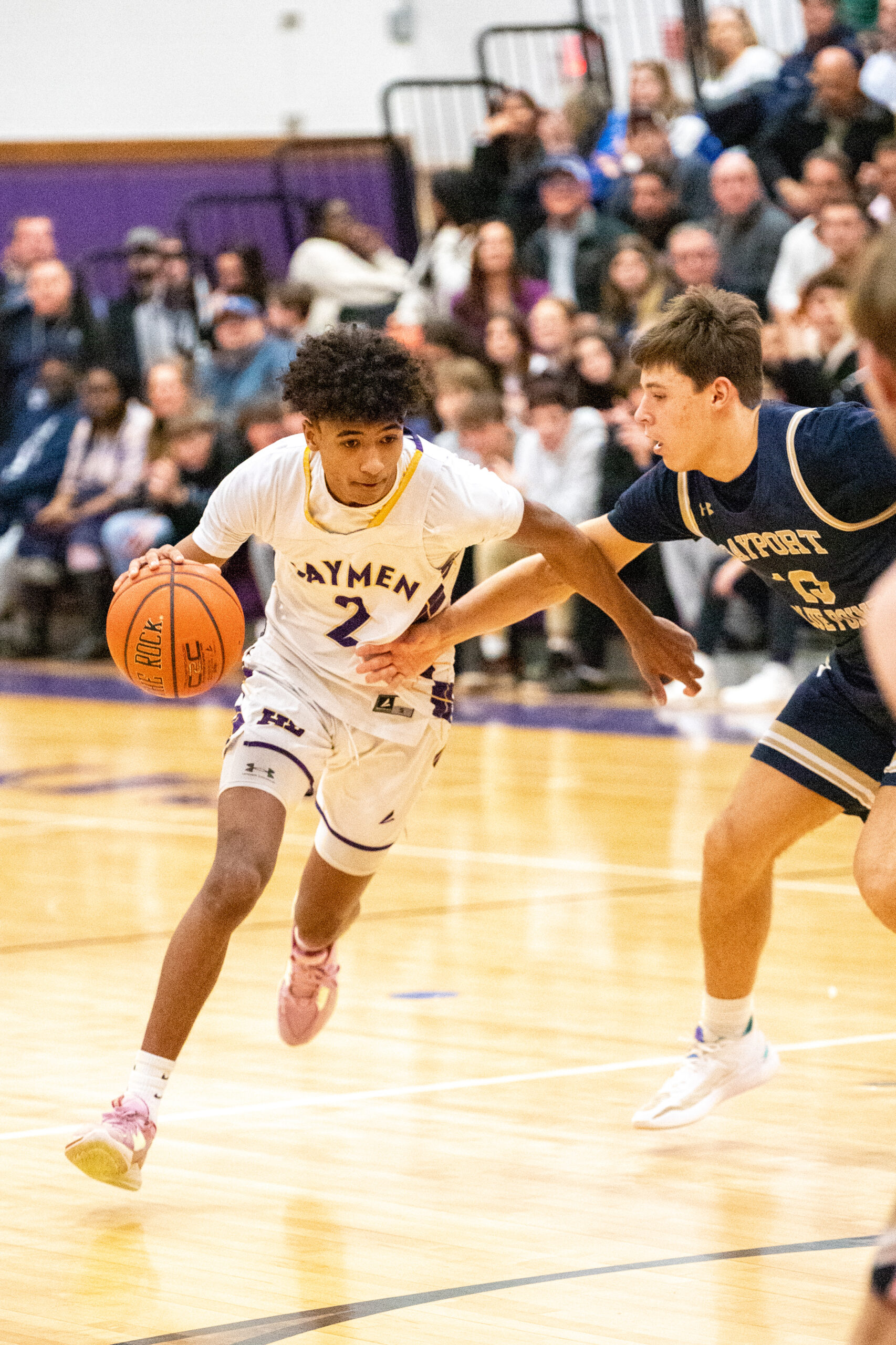 Senior guard Kazmin Pensa-Johnson drives around Bayport-Blue Point's Mike Luce. MICHAEL O'CONNOR