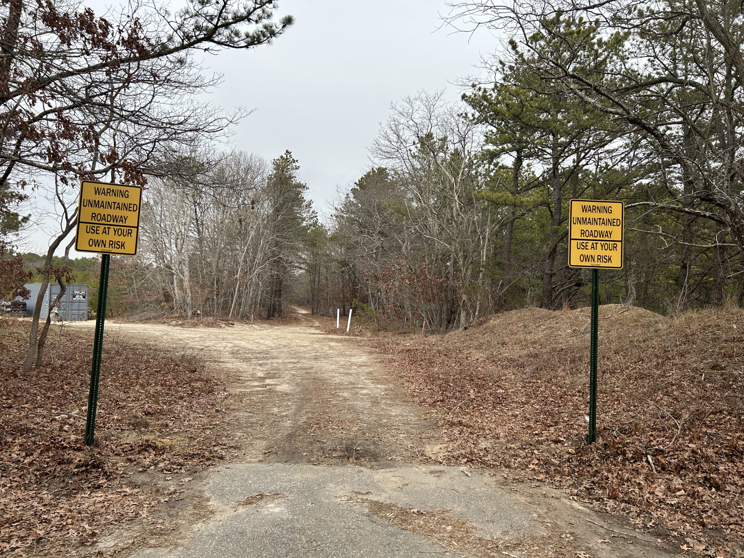 Southampton Town Highway Superintendent Charles McArdle removed a fence erected by the developers of the Lewis Road golf course developers at the end of Spinney Road. He envisions creating a trail, replete with a bridge,  on the public access that leads all the way across Sunrise Highway.   KITTY MERRILL