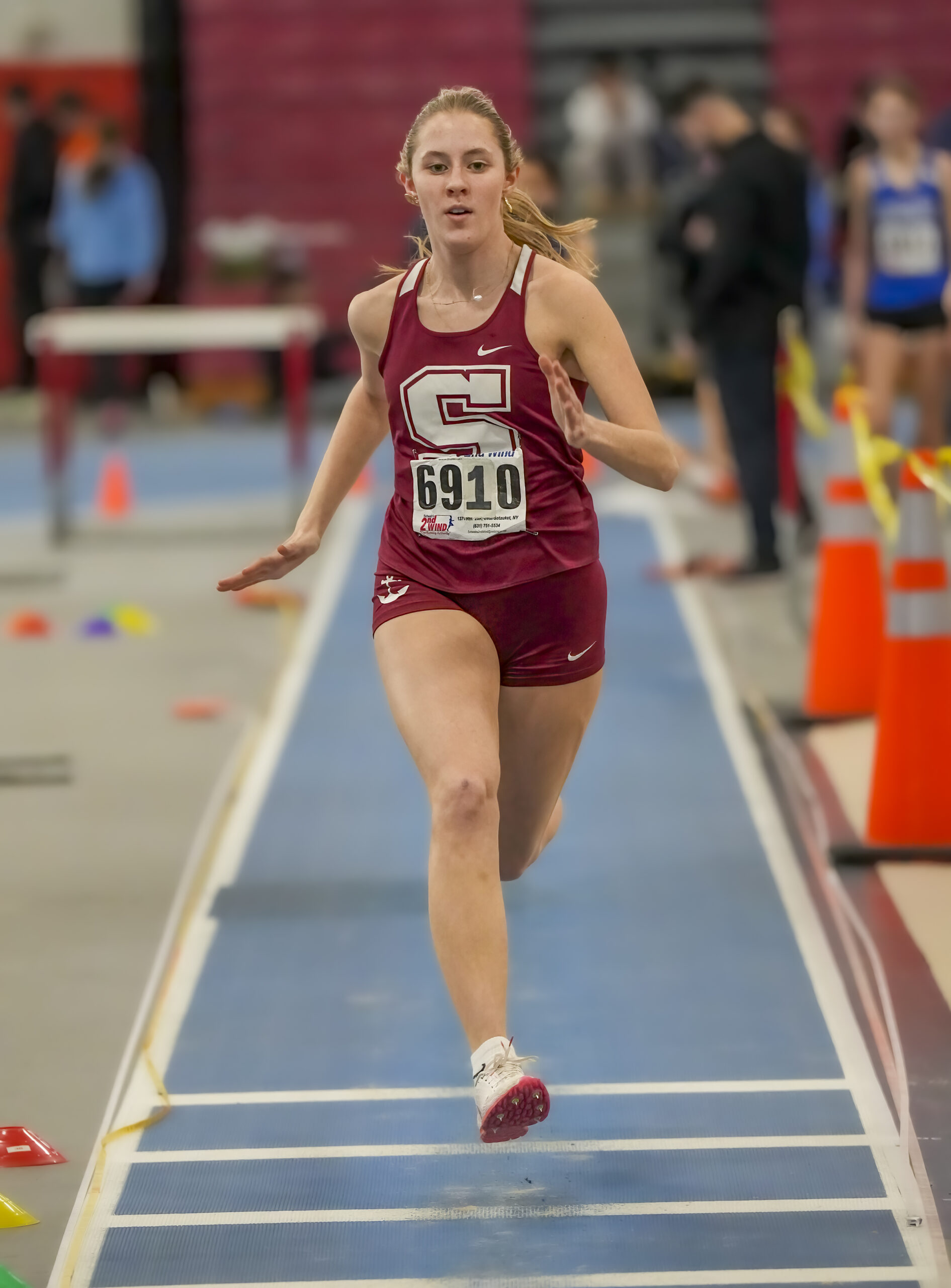 Southampton's Emily Zukosky competing in the triple jump.  RON ESPOSITO