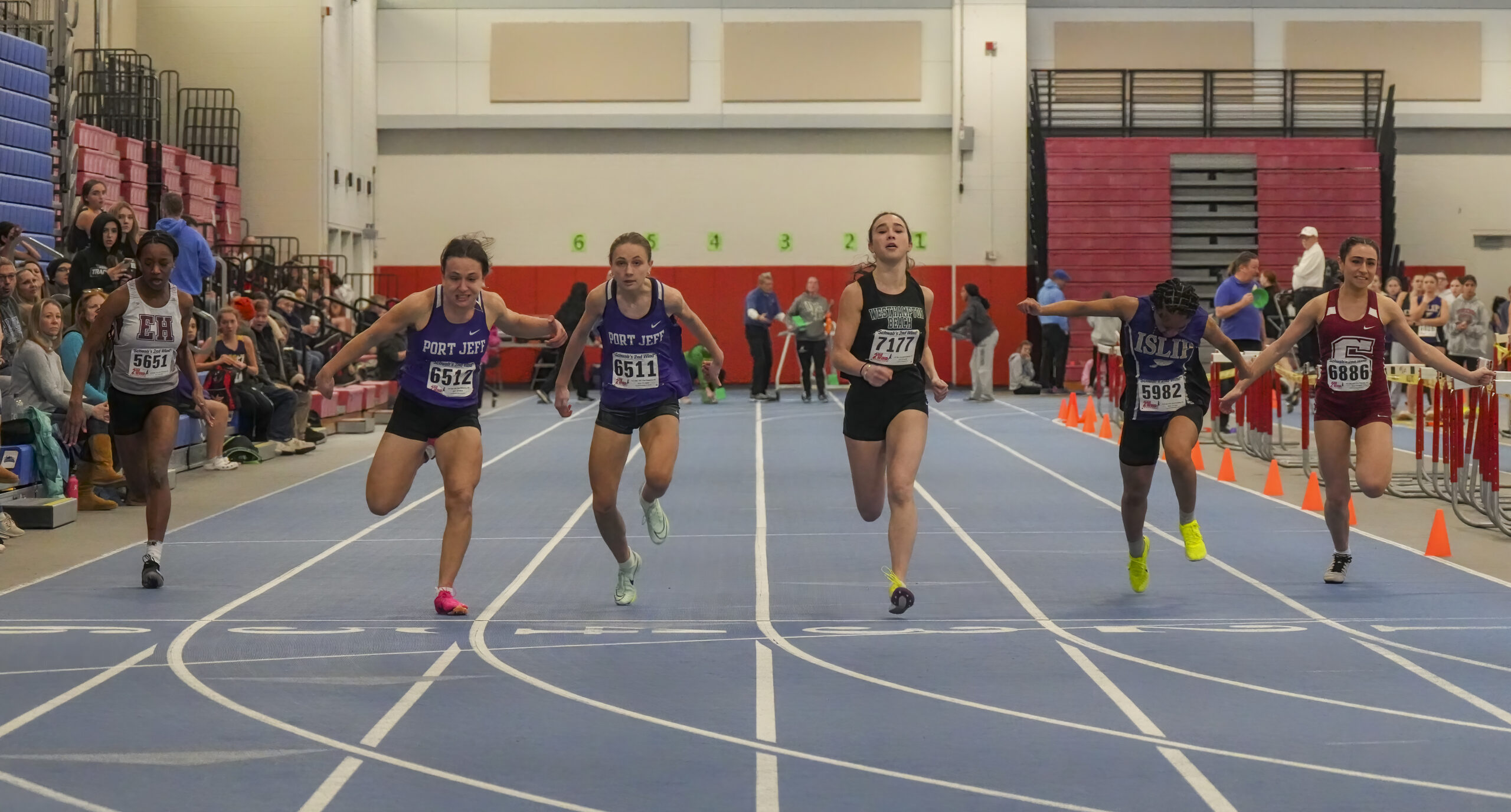 The finals of the 55-meter dash on Saturday featured three South Fork runners in Bridgehampton's Leslie Samuel, far left, Halle Geller of Westhampton Beach, in the middle, and Southampton's Kyla Cerullo, far right. RON ESPOSITO
