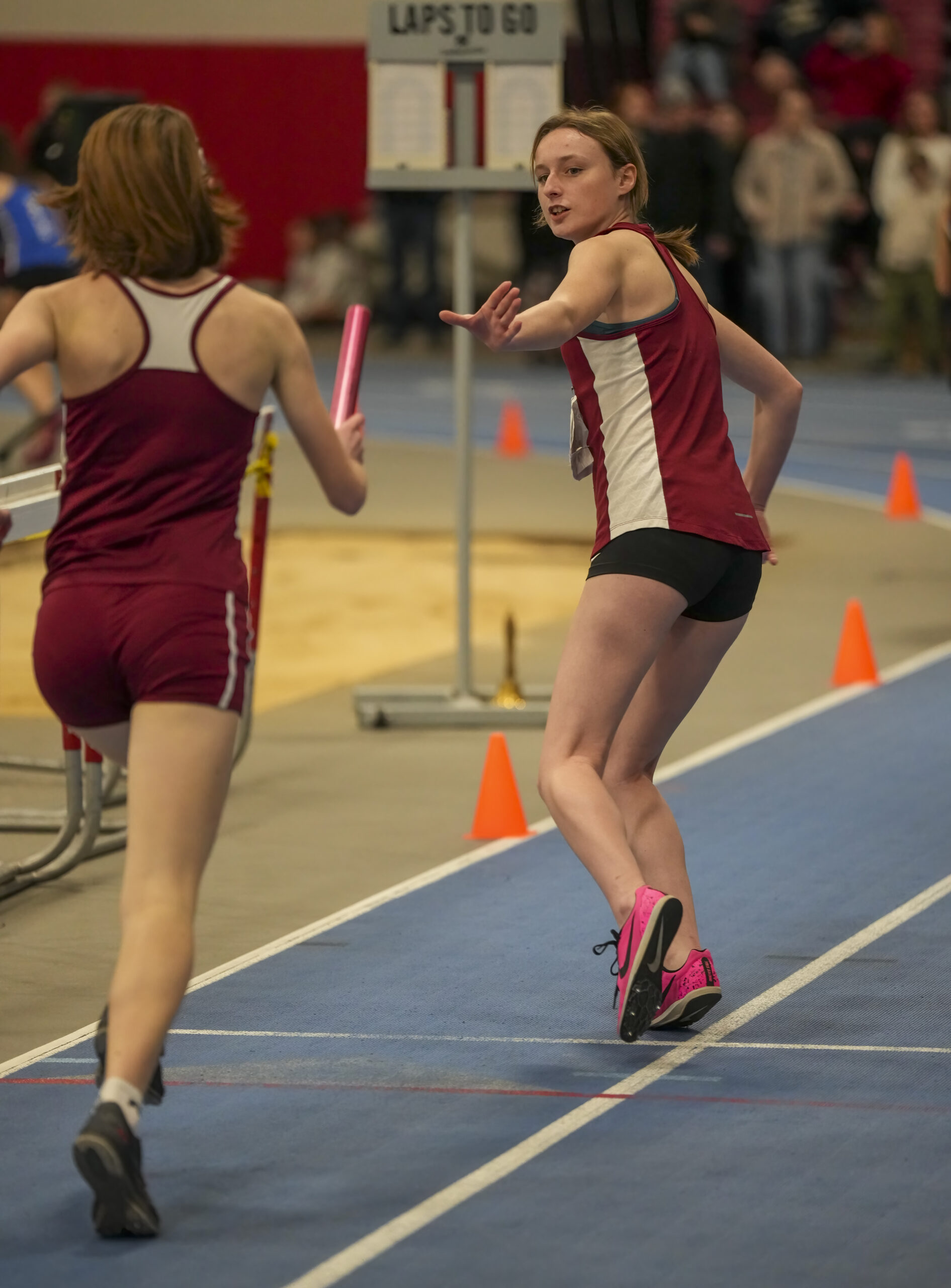 Hayden Gilmartin gets set to take the baton from Lily Tevli in the 4x800-meter race.   RON ESPOSITO