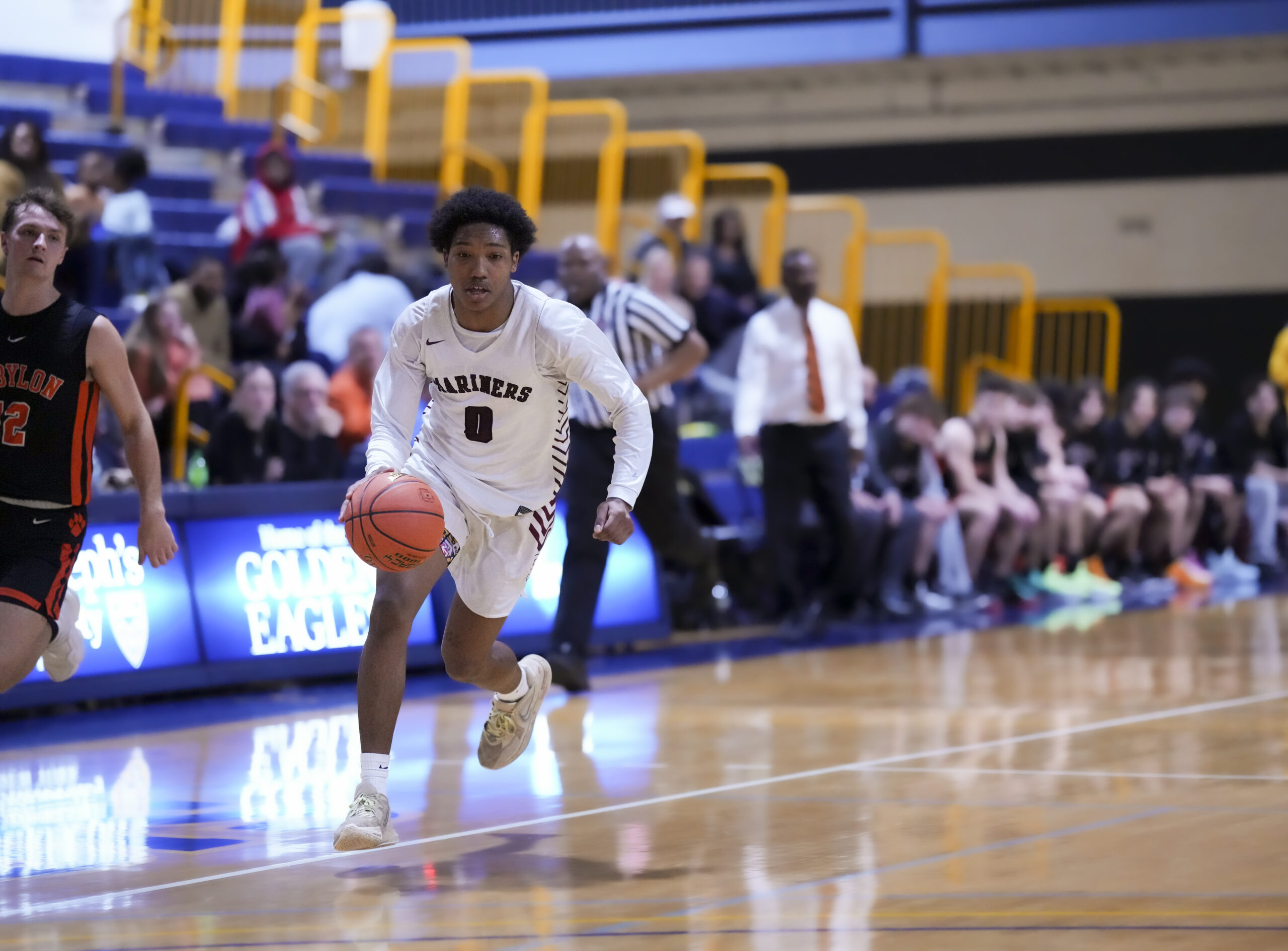 Southampton sophomore Naevon Williams races down the court after a steal.   RON ESPOSITO