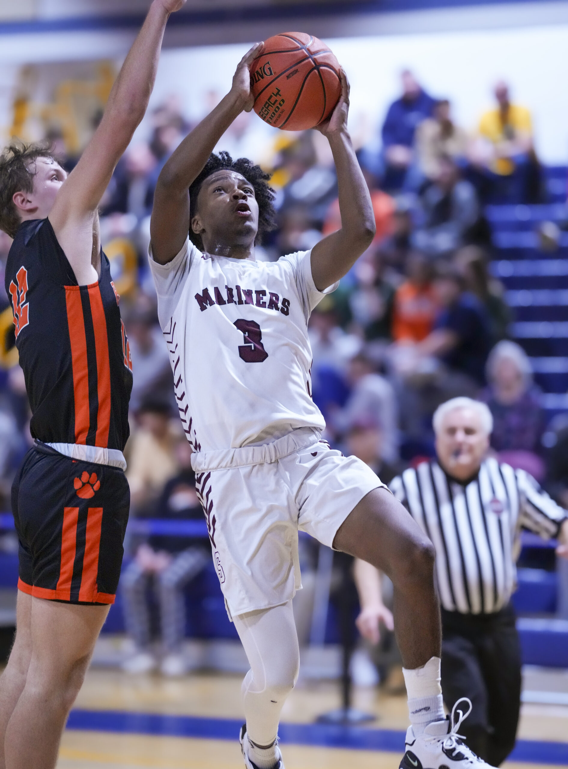 Derek Reed scored career points 1,000 and 1,001 on a layup late in the fourth quarter.    RON ESPOSITO